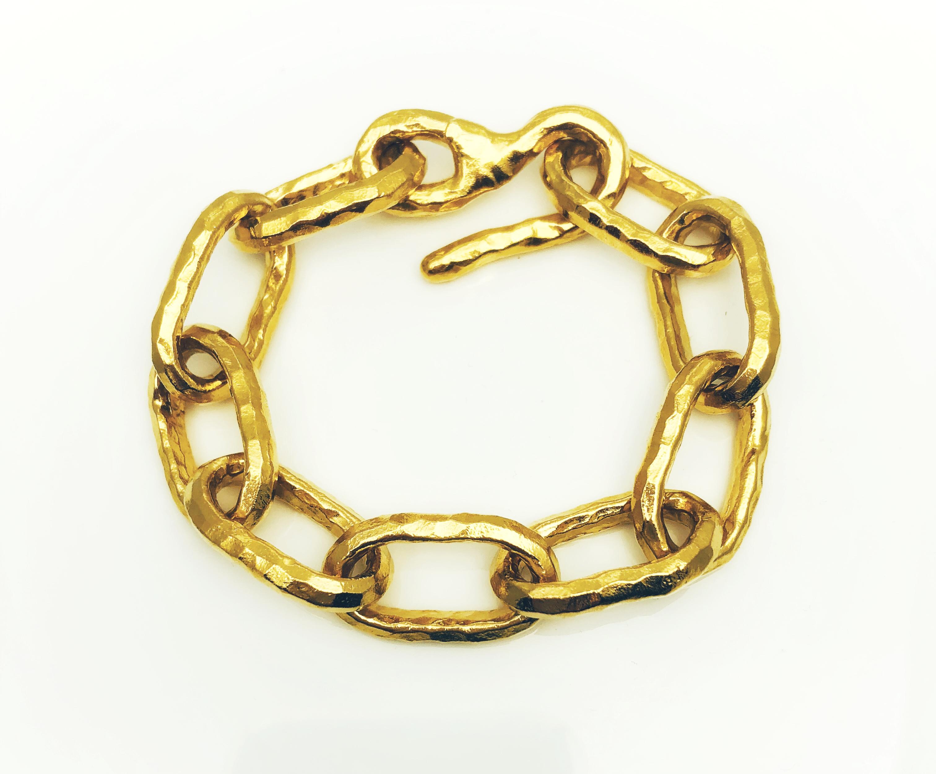 This Custom made Fashion Bracelet was designed by Jean mashie and is made of 22 Kt, hammered, yellow Gold. This 8 inch bracelet has oval shaped links and an 