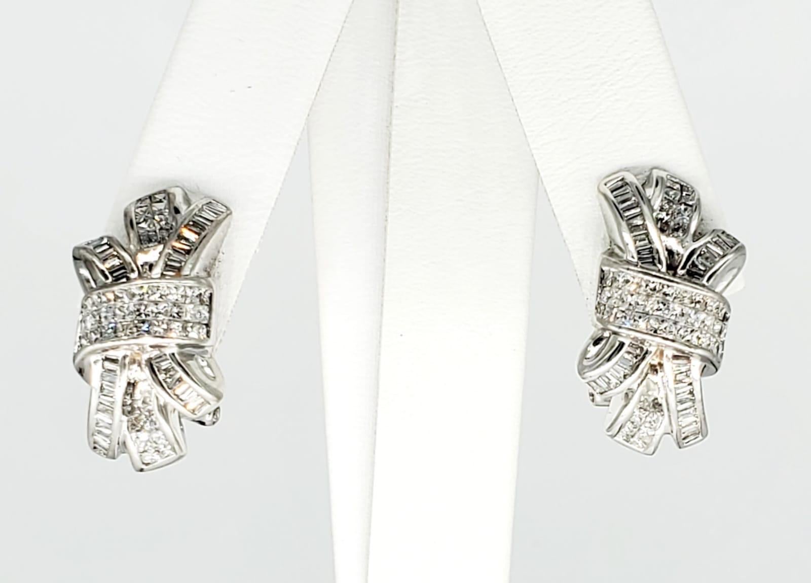 6 Carats VS Clarity Total Diamond Weight Clip Earrings. There is an approx total of 6 carats of baguette and princess cut H/VS Clarity diamonds all over these magnificent pair of diamond earrings. The designer JPM really did a good job on this pair.
