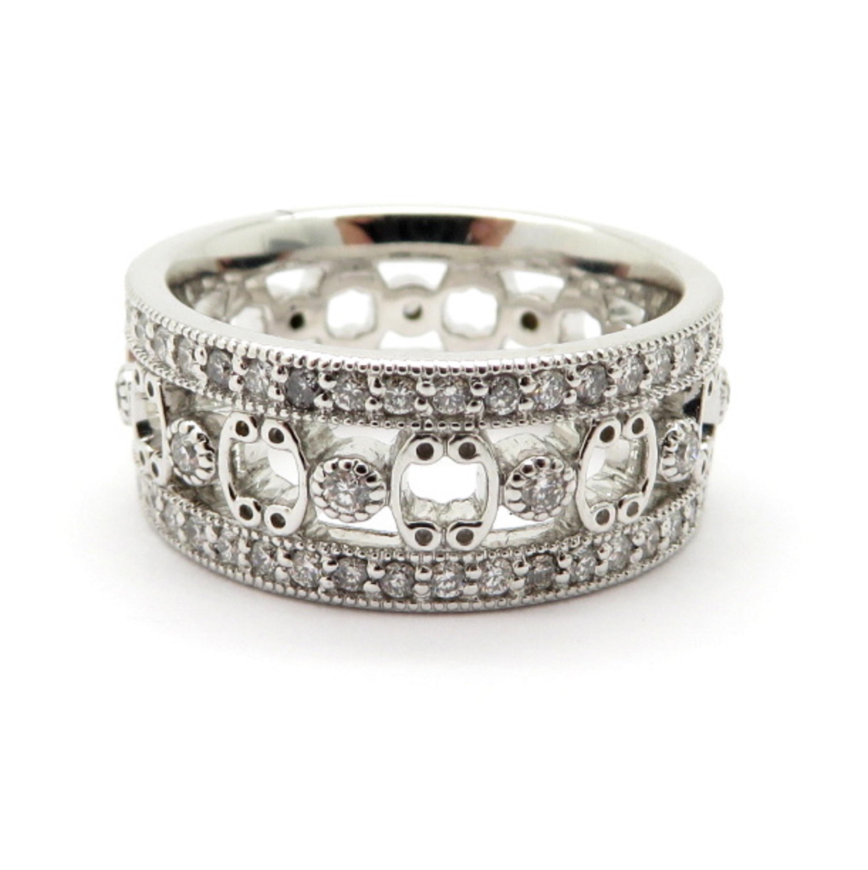Designer Jude Frances diamond 18K white gold eternity band ring. Showcasing numerous round brilliant cut bead set diamonds weighing a combined total of 0.75 carats. Diamond grading: color grade: G – H. Clarity grade: VS1. The mounting measures 8.15