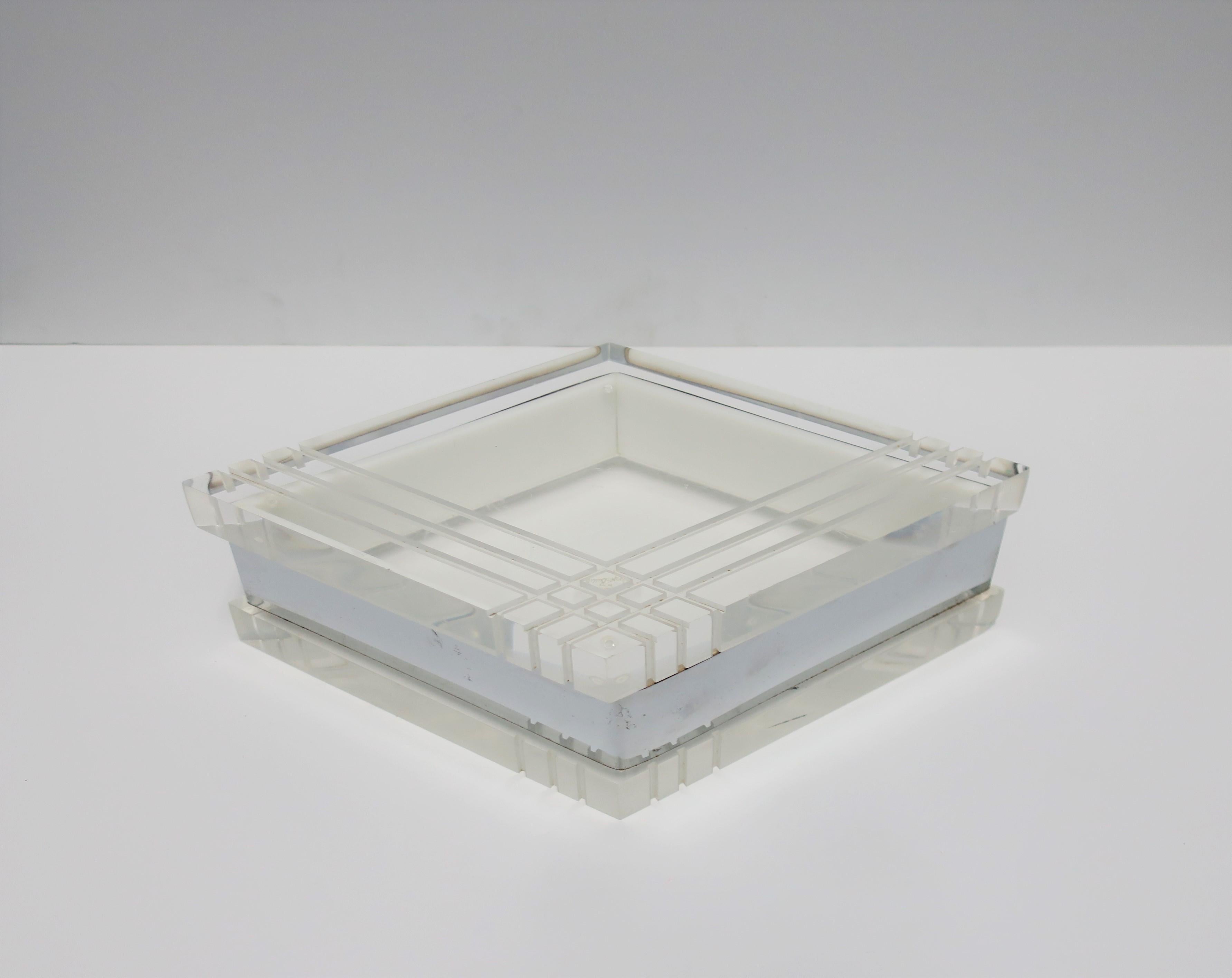 A substantial Modern style or Postmodern period marque Lucite and chrome jewelry or storage box by designer George Bullitt, circa late 1970s-1980s. Lucite top and base are 1