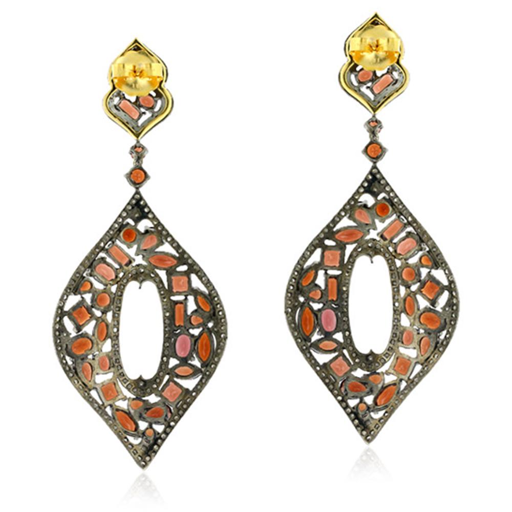 Designer Marquee shape Mosaic Garnet and Diamond Dangle Earring in Silver and Gold is dressy, fun and unique.

18kt gold:1.36gms
Silver:20.84gms
Diamond:2.8cts 
Garnet:17.65cts
