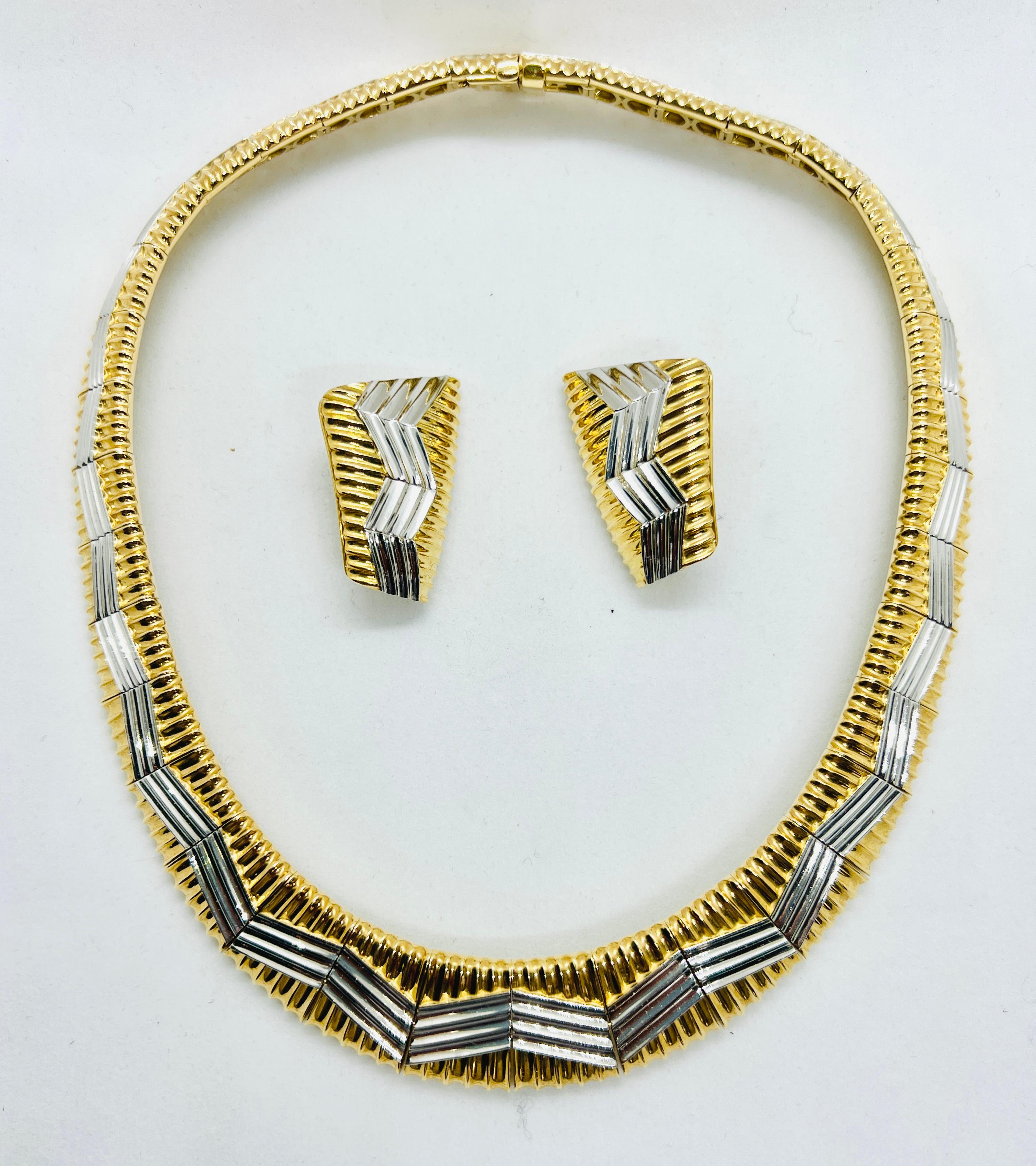 Absolutely Stunning Michael Bondanza 18Kt Yellow Gold and Platinum Necklace and Earrings Suite! The necklace is 3/4 inches at its widest and the earrings measure 1.25 inches by 1 inch. The set weighs 224.5 grams. Please read below directly from the