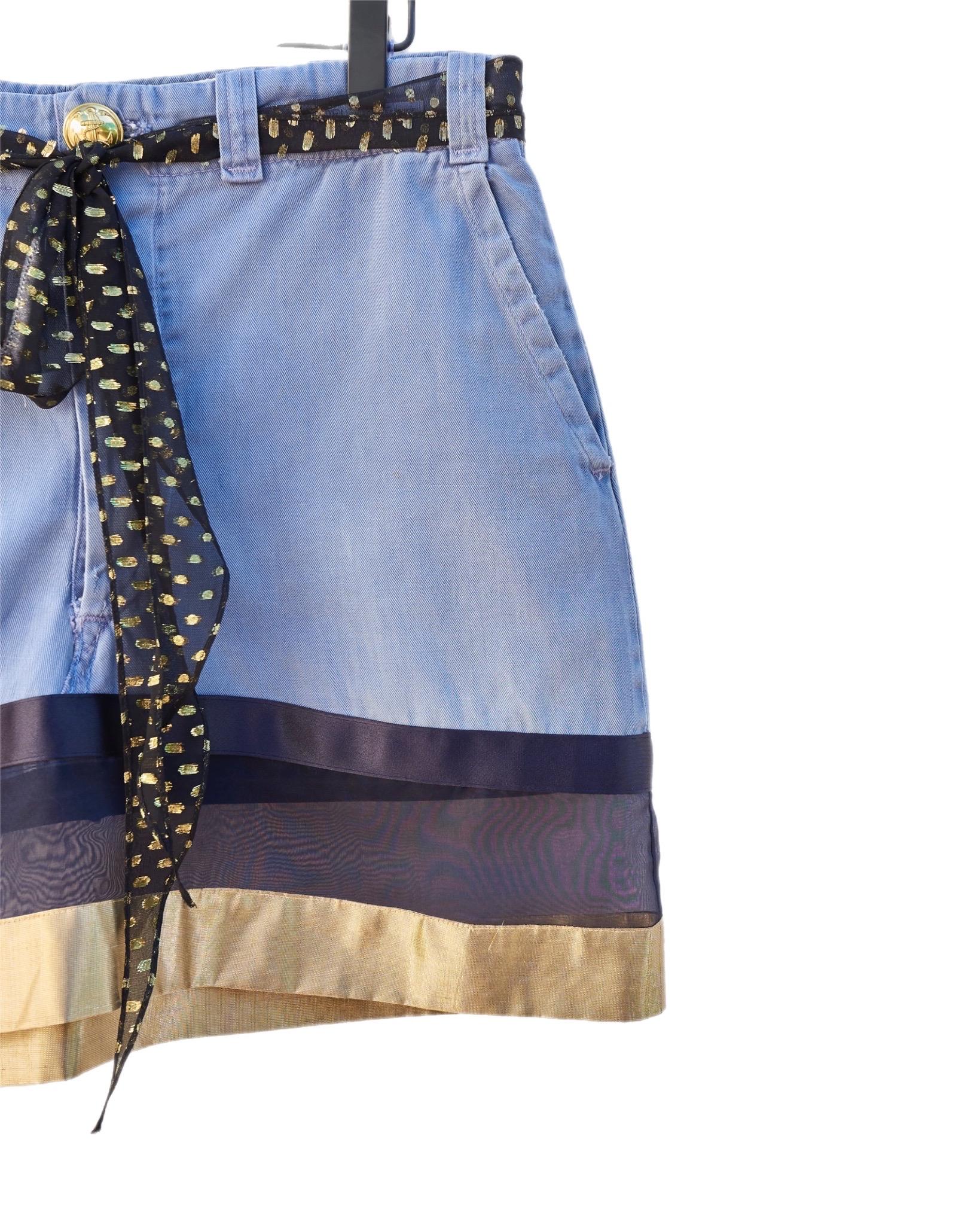 Designer J Dauphin 
Designer Mini Skirt Vintage Work Wear Blue Cotton Organza Transparent Stripe Gold with Silk Chiffon Black Gold Lurex Belt

This Skirt is made out of Repurposed Vintage Work Wear and Military Gold Tone Brass buttons Made in Paris