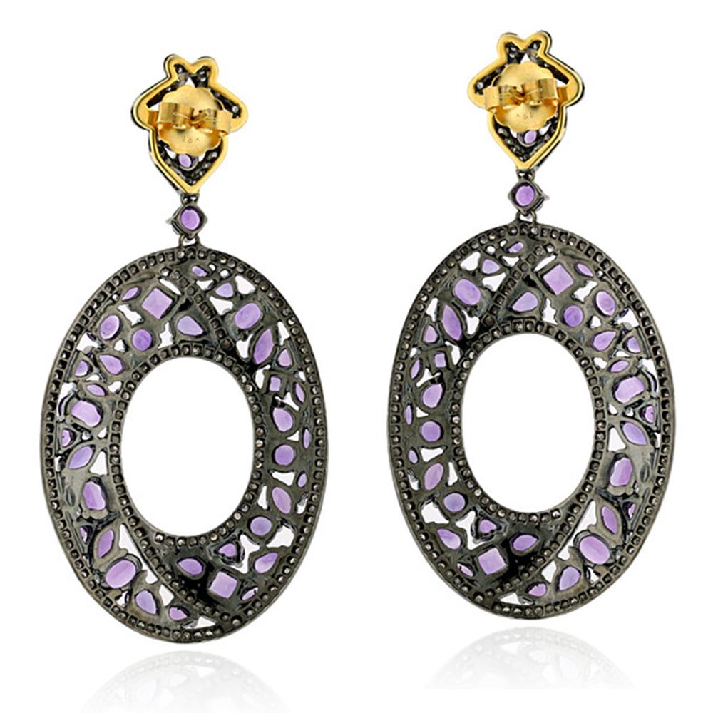 This designer Mosaic style Amethyst and Diamond Dangle Earring in Silver and Gold is dressy, fun and unique.

18kt gold: 2.82gms
Diamond: 3.09cts
Silver: 23.46gms
Amethyst: 13.38cts
