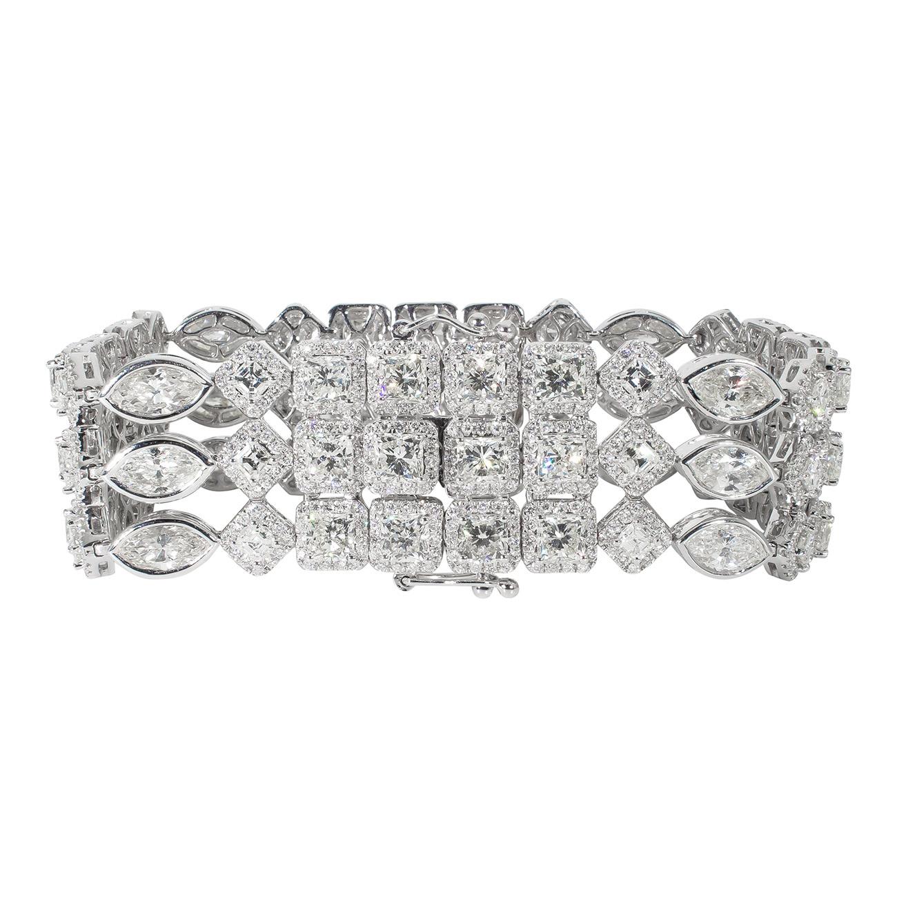 Designer bracelet in 18K white gold with multi-row French pave set rounds around cushion cuts, asscher cuts, and marquise diamonds. D30.56ct.t.w.