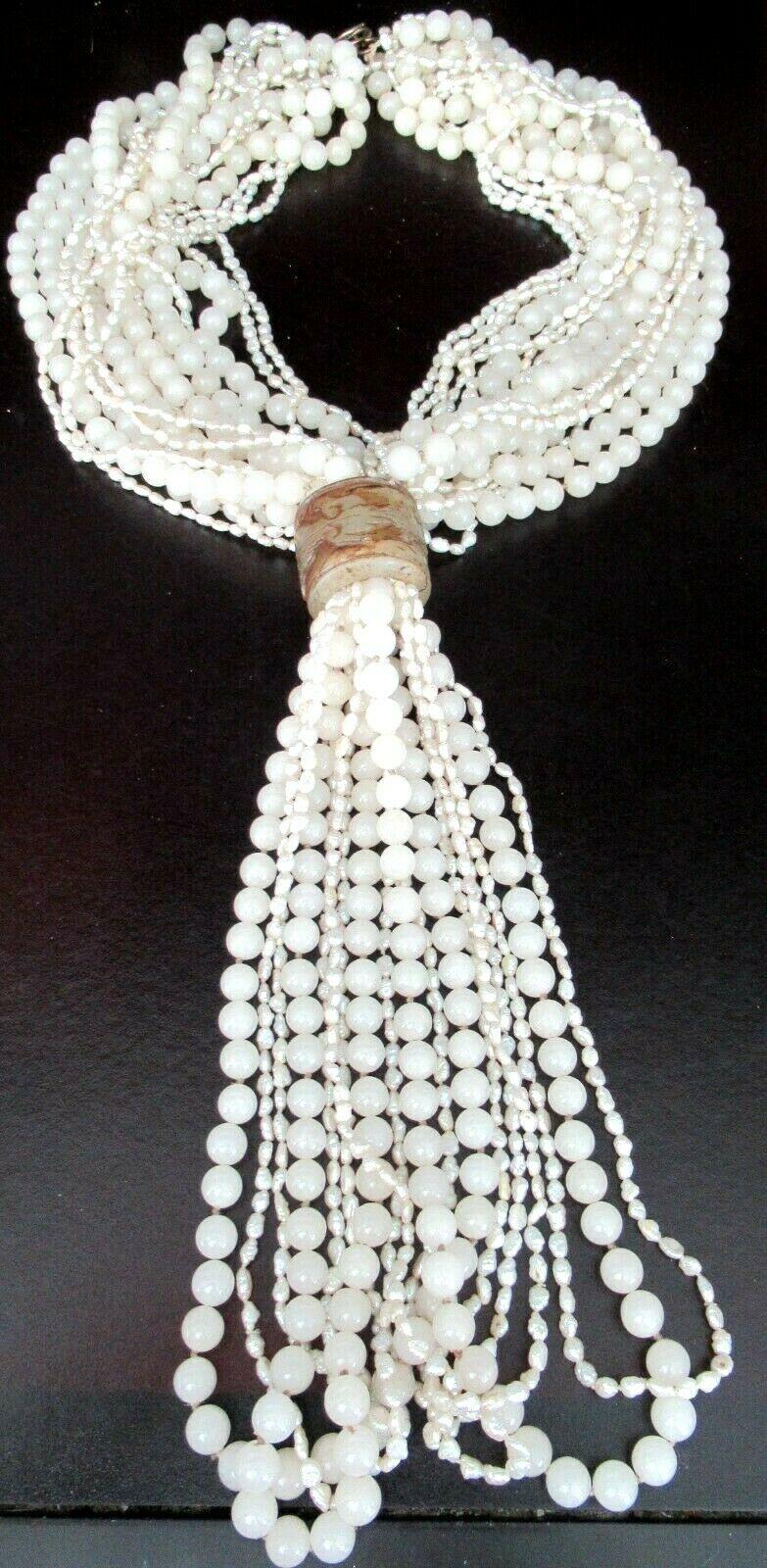 Simply Beautiful! Sensational High Quality 18 strand Necklace comprising Pearls of various shapes and sizes with a Carved Quartz enhancement. Clasp marked Silver on the back with a seahorse on the front. Necklace measures approx. 20