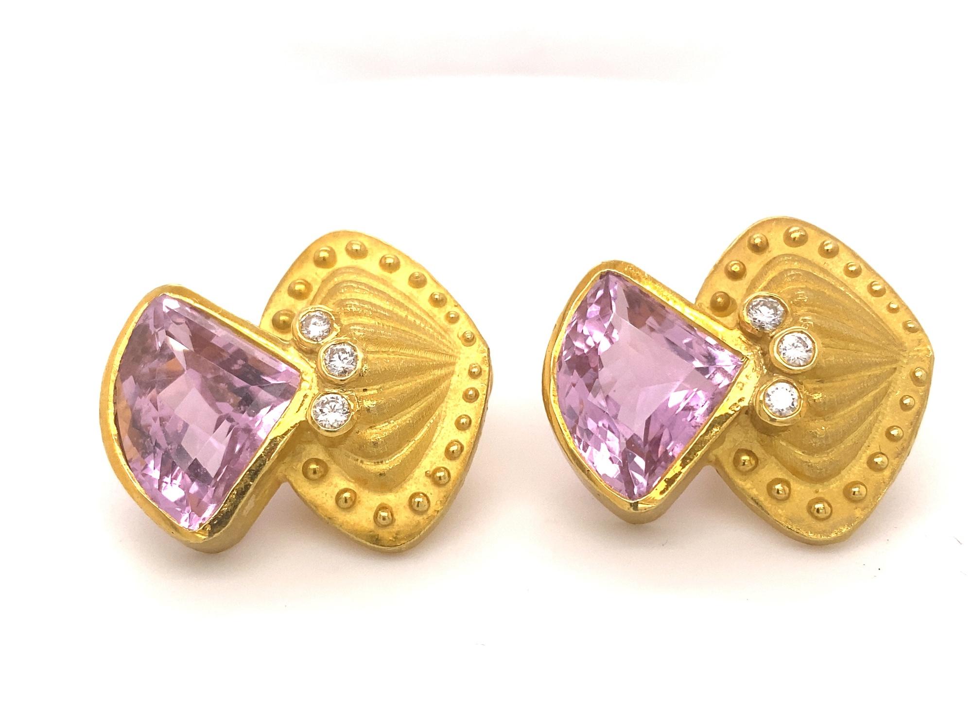  This is a beautiful pair of designer statement earrings made by Nerso. The earrings have a unique design set with six round diamonds and 2 triangular shaped kunzites. The kunzites measure 21mm by 16mm they have amazing bright deep pink color and