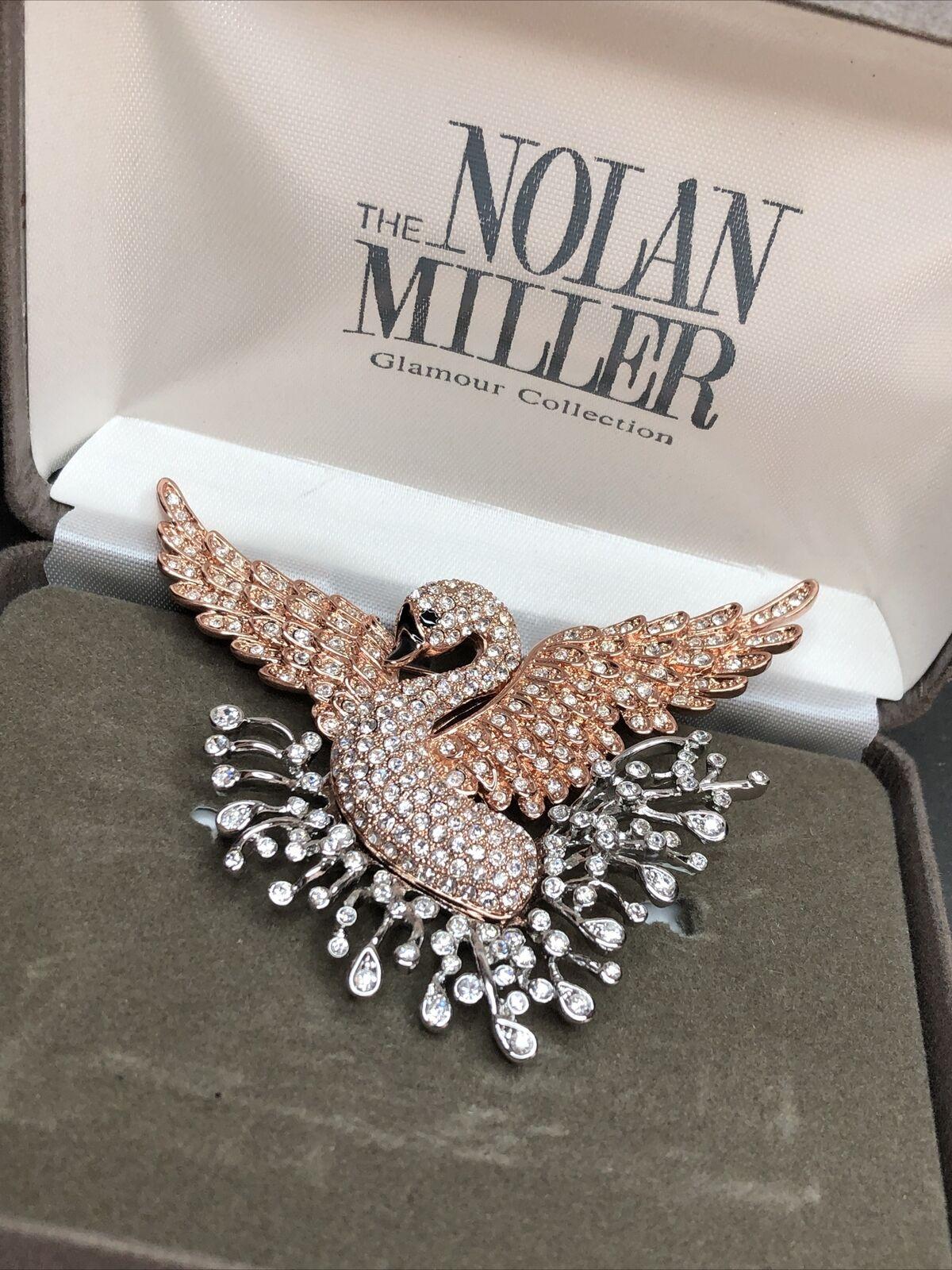 Simply Beautiful! Designer Nolan Miller Signed Brooch featuring a Signature Swan encrusted with Sparkling Crystals. Approx. 2.50” tall x 3.00” w. Original Box. More Beautiful in Real time! A Timeless Treasure you’ll turn to Time and Again! 
