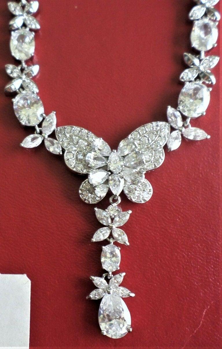 Simply Beautiful! Nolan Miller Necklace encrusted with Diamante Crystals, featuring a Butterfly design with assorted Crystals set along the necklace. Silver tone mounting. Measures 16