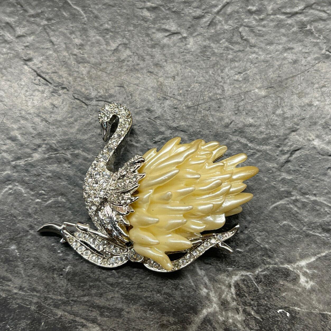 Simply Beautiful! Designer Nolan Miller Signed Vintage Brooch featuring a Swimming Swan encrusted with Sparkling Crystals and Faux Pearl Feathers. Approx. 2” tall x 2” w. Original Box. More Beautiful in Real time! A sure to be admired Treasure