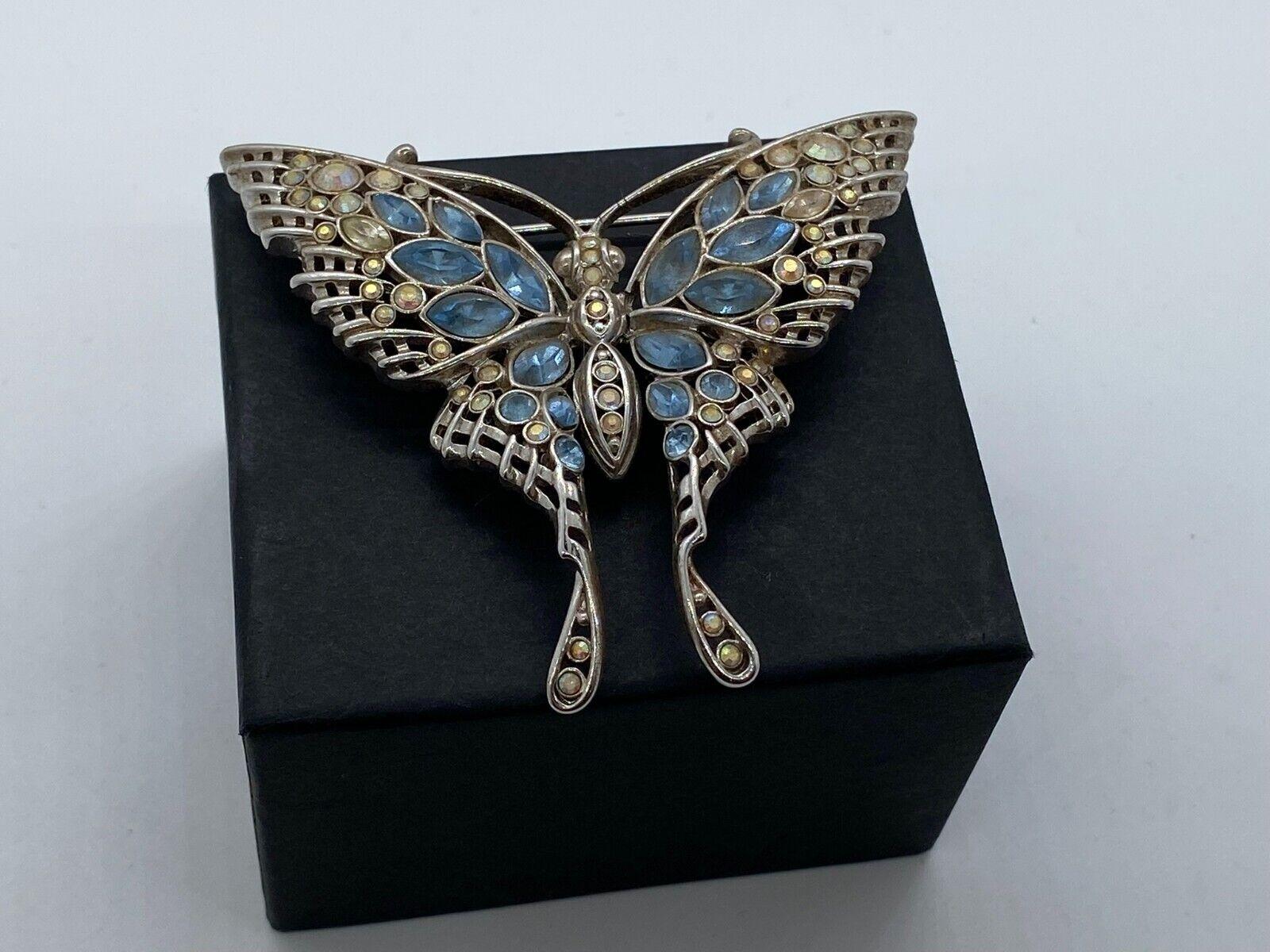 Simply Beautiful! Signed Nolan Miller Designer Blue and Clear Crystal Dragonfly Brooch. Hand set with a myriad of Sparkling Crystals in blue and clear. Stunning Statement Brooch! Measuring approx. 2.5