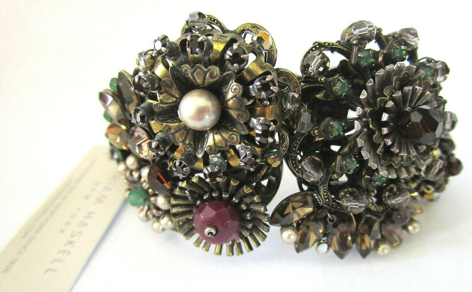 Awesome Miriam Haskell Designer Clamper Bracelet featuring encrusted Flowers with Rhinestones and faux Pearl. Antiqued Bronze tone. Exquisite Signed piece! Never worn.  A Stunning Fashion Statement…A Perfect compliment to your wardrobe! 
