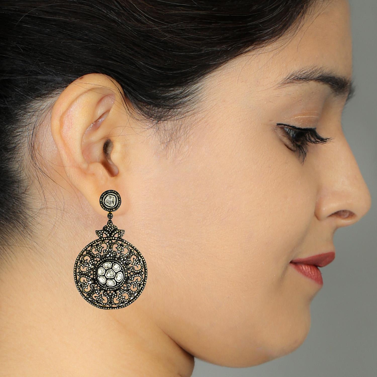 This Designer Pave and Rosecut and Diamond Dangling Earring in Silver and 14K Gold is a one of the most charming earring in our collection

Closure: Push Post

14kt Gold :5.16gms
Diamond:5.45cts
Silver:26.03gms