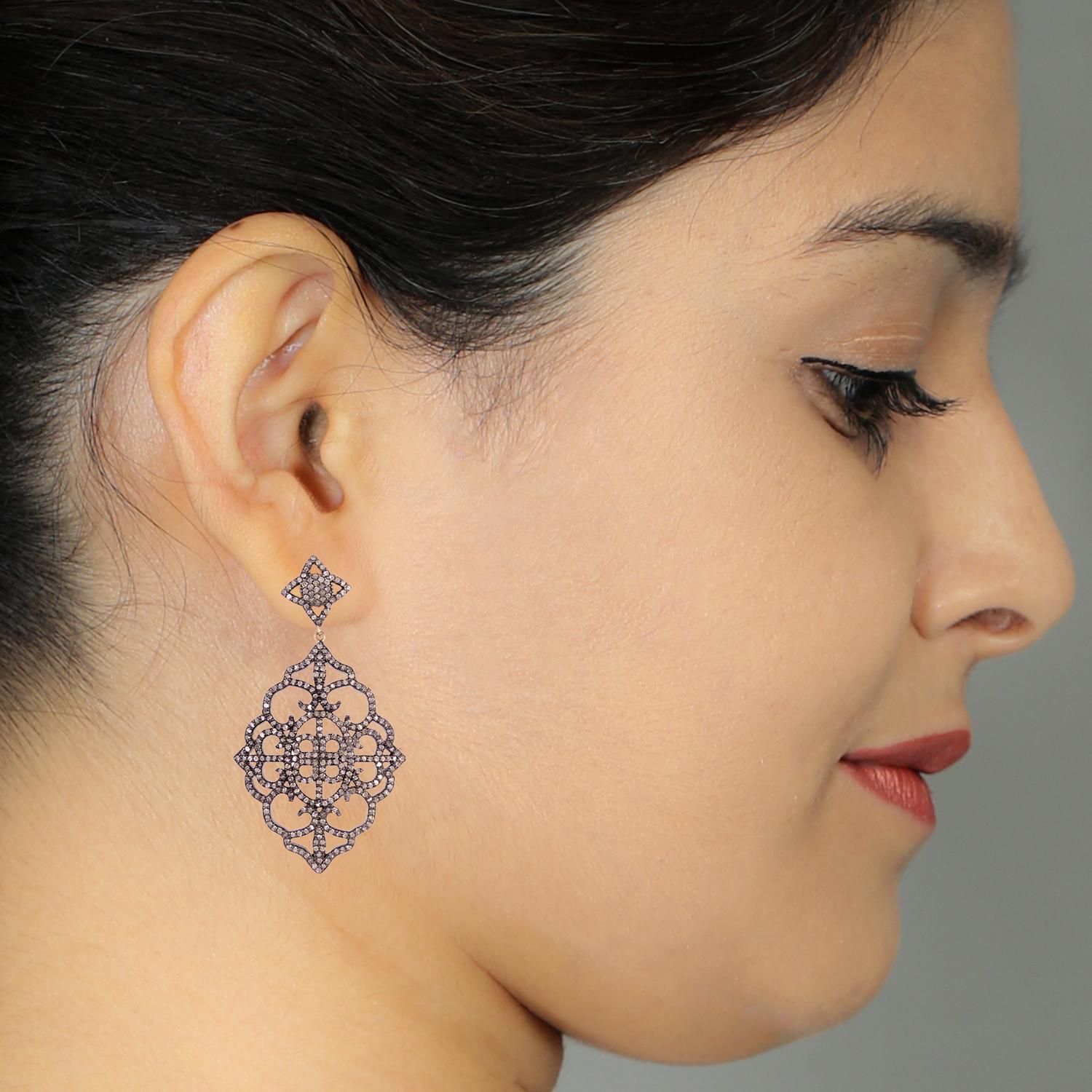 Designer Pave Diamond Earring in 14K gold and silver can be paired with any casual or Semi-formal affair for a chic look.

14kt gold:1.31gms
Diamond:4.15cts
Silver:17.28gms
