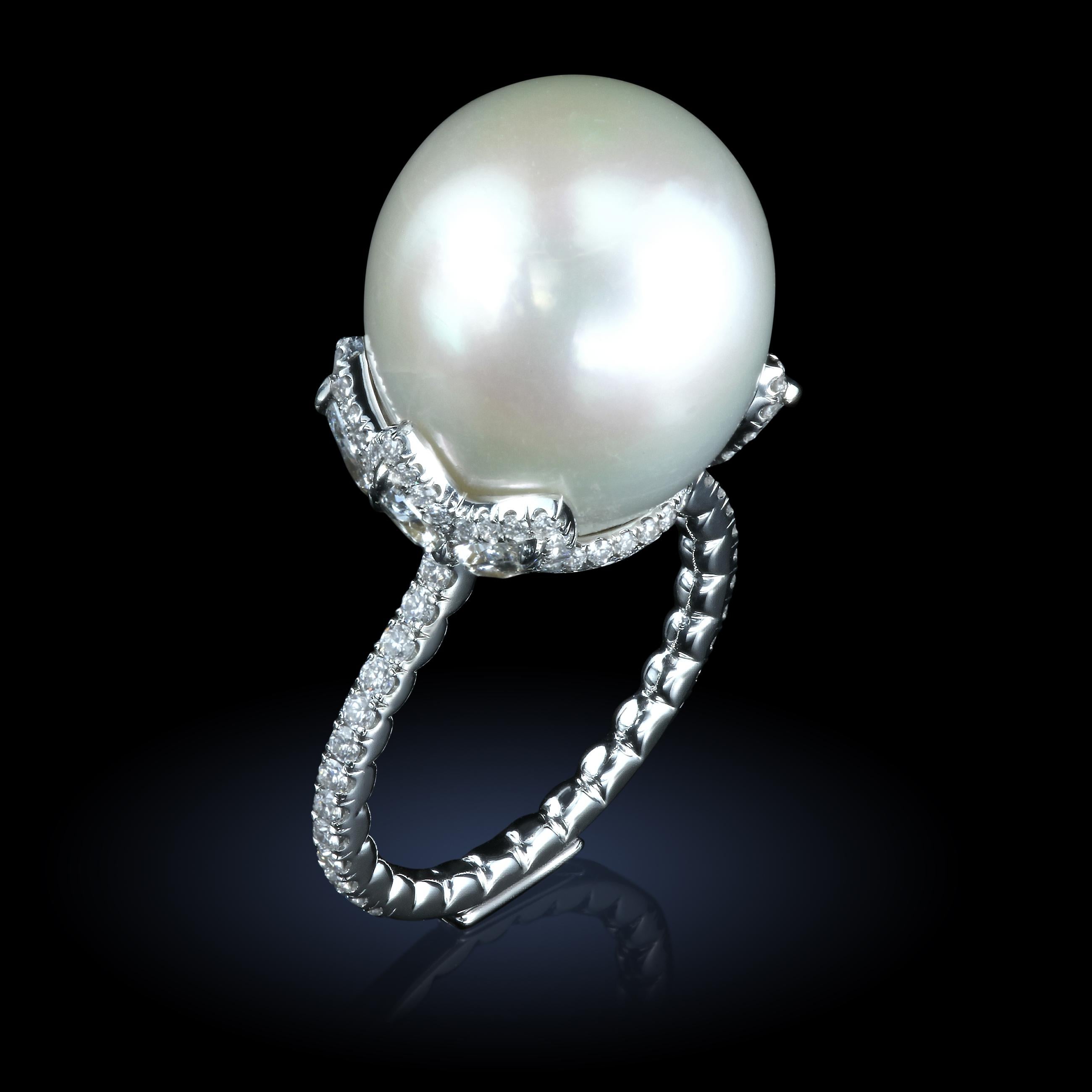 Pearl and diamond platinum ring by the world-famous jewelry designer Maestro Leon Mege.
Finger size: US - 5 3/4 

15x17 mm white South Sea Pearl
6 pear shape diamonds 1.03 carats total weight
128 full cut diamonds 0.93 carats total weight
