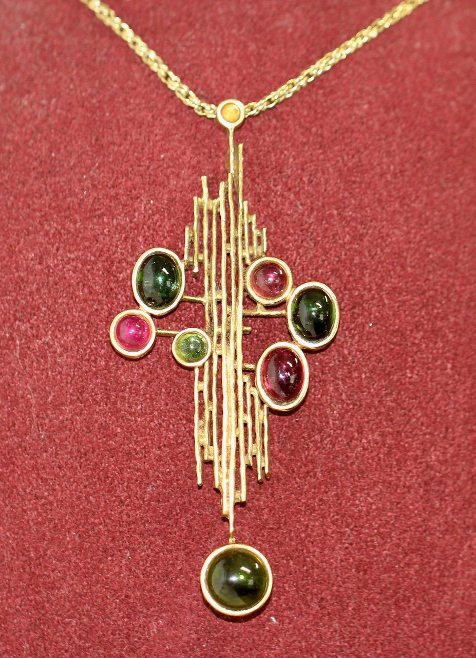Exceptional large Vintage designer pendant with chain by Grosse, Christian Dior. 18k gold with various gemstones Cabochons (probably Turmaline and Amethyst).

Solid 18k gold pendant and chain. Genuine handwork from Grosse, Germany. Hallmarked.
Year