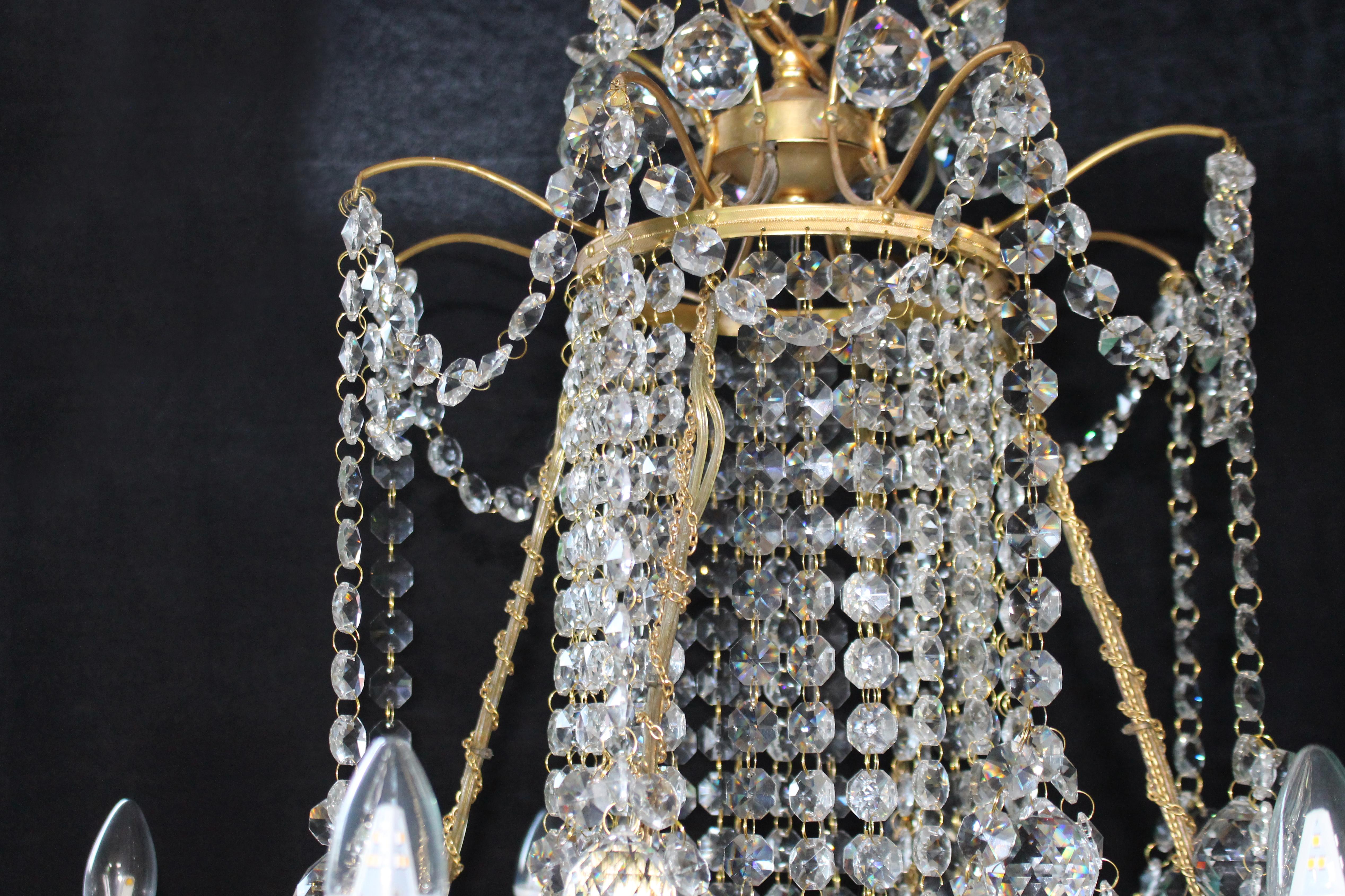 Contemporary Designer Profusely Dressed Crystal Gilt Metal Chandelier For Sale