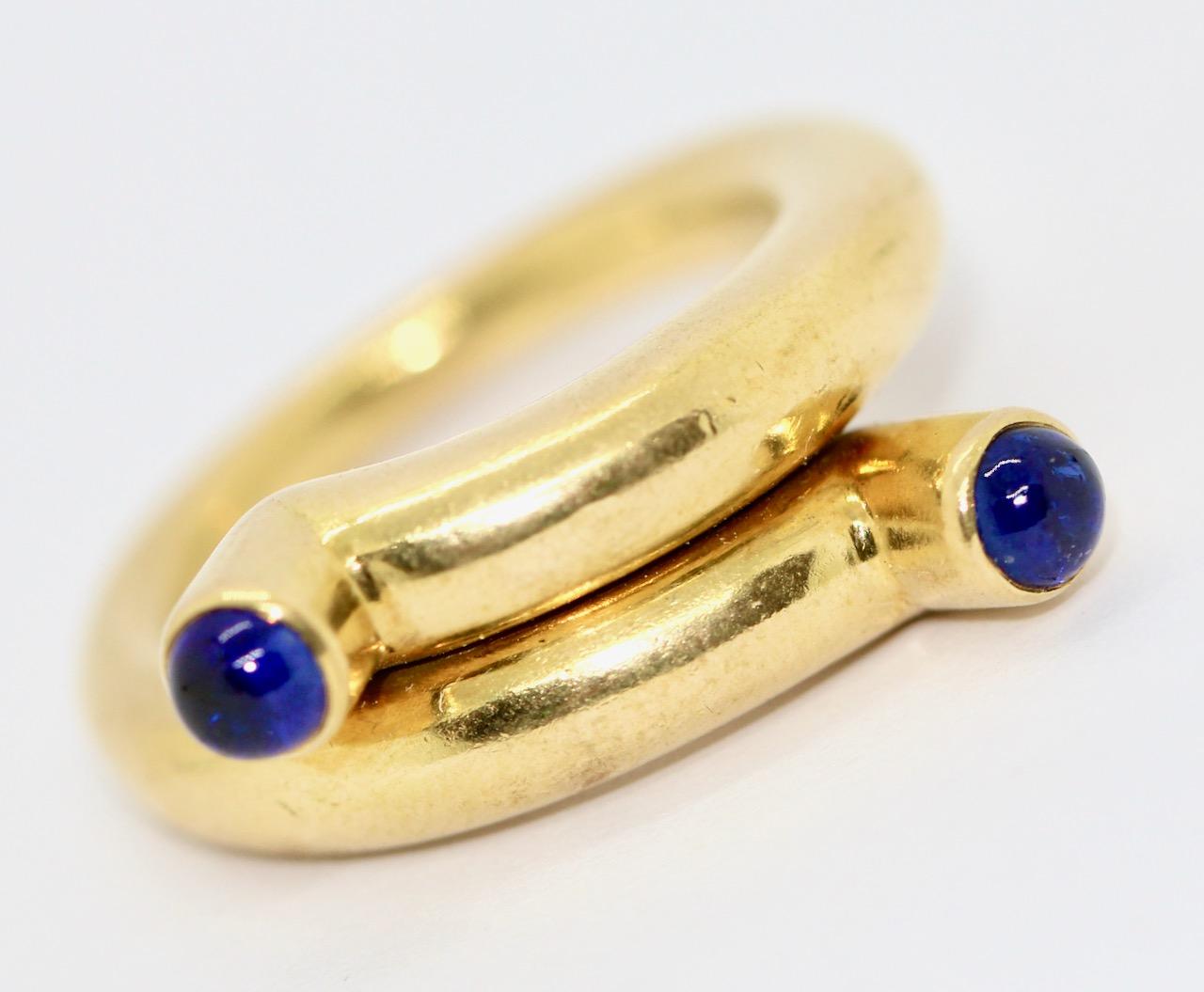 Designer ring by Tiffany & Co, Jean Schlumberger, 18k gold with sapphire cabochons.

Includes certificate of authenticity.