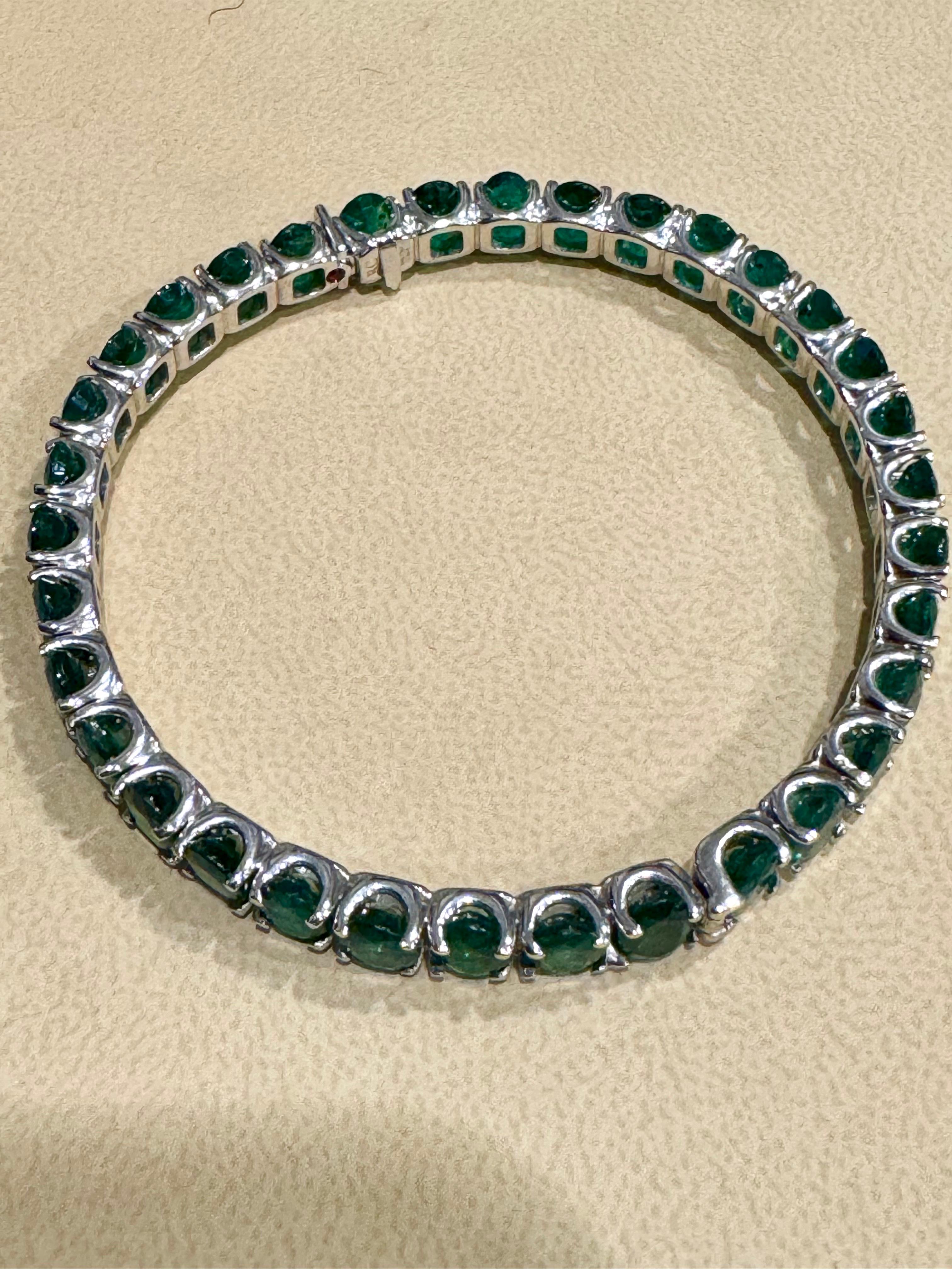 For an affordable price, indulge in designer elegance with the Roberto Coin bangle bracelet, a signature piece from the renowned designer. Originating from Zambia, this exquisite piece features approximately 25 carats of oval emeralds, totaling 37