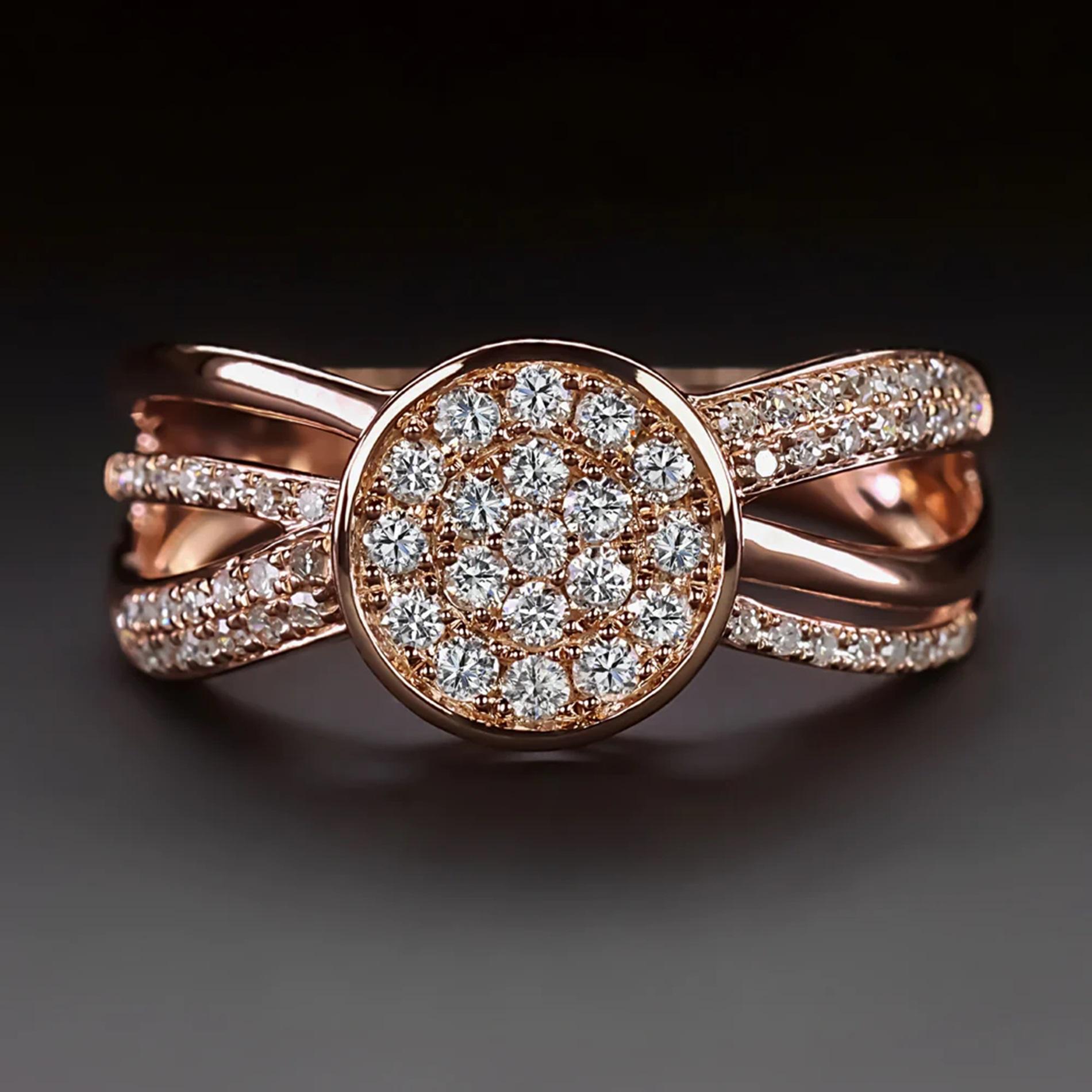 vintage designer ring bears the EFFY hallmark and is luxuriously designed with an eye catching pave diamond center and a criss crossing split shank design! Between the glittering diamonds and substantial 14k rose gold setting, this ring has an air