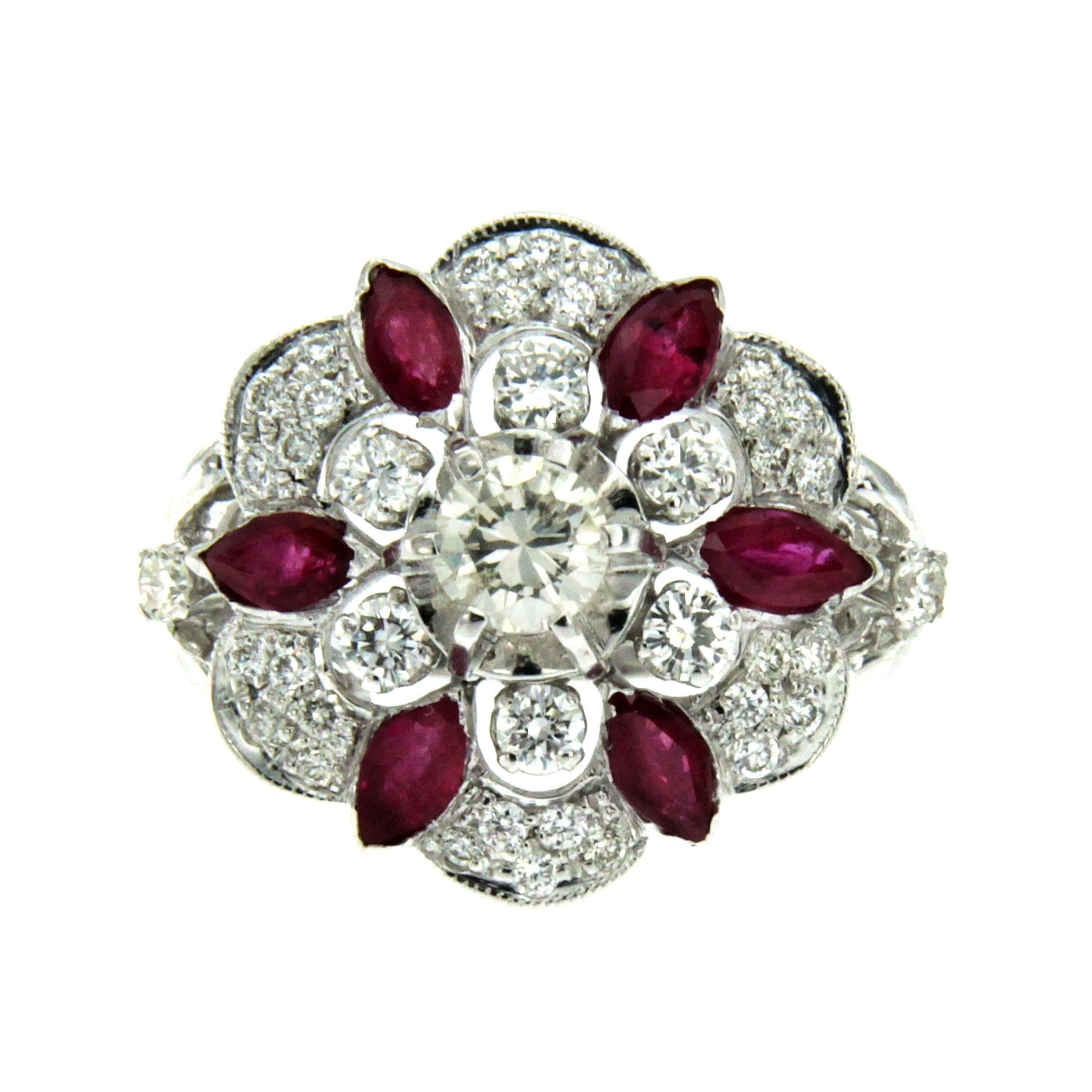 A master-crafted 18k Gold ring composed of round brilliant cut Diamonds weighing approx. 0.90 ct  graded color F-G clarity Vs and navette cut Rubies of approx. 0.95 total carats.
Circa 1950

CONDITION: Pre-owned - Excellent
METAL: 18k yellow and