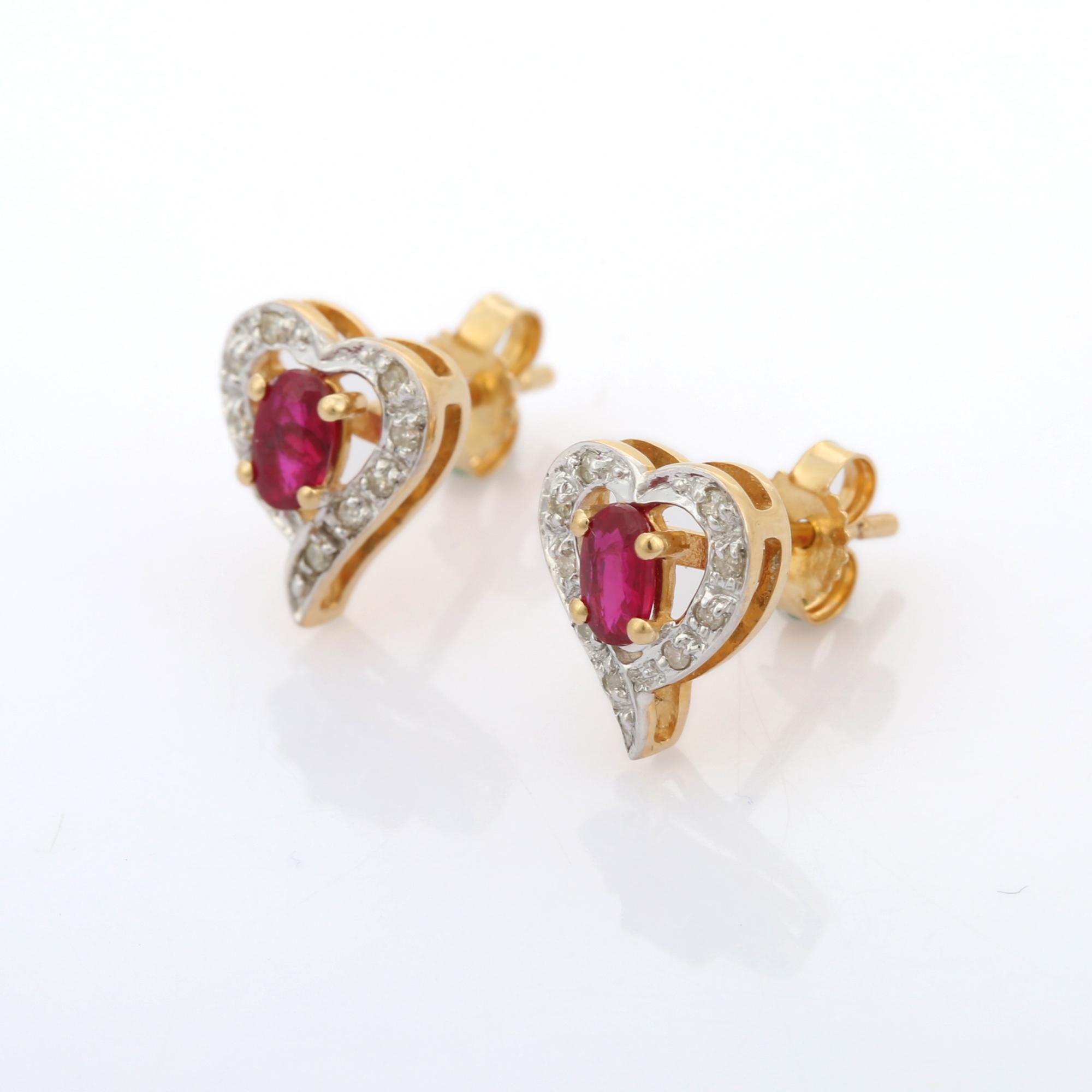 Studs create a subtle beauty while showcasing the colors of the natural precious gemstones and illuminating diamonds making a statement.
Designer Ruby Diamond Heart Stud Earrings in 14K gold. Embrace your look with these stunning pair of earrings