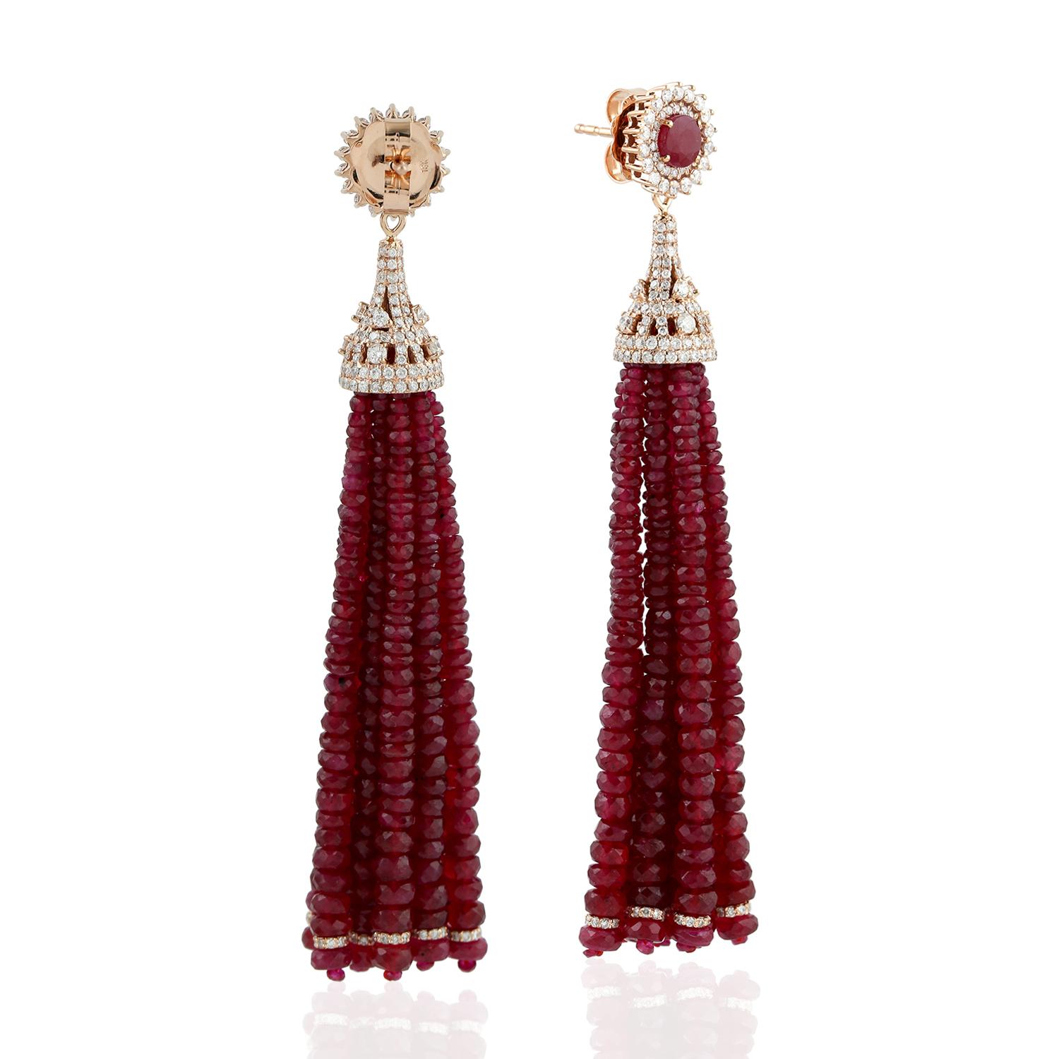 This designer Ruby Tassel Dangle Earring in 18K Gold with Diamonds would make your heart miss a beat. This earring is full of happiness and love.

Closure: Push Post

18K Gold:10.728gms
Diamond:2.96cts
Ruby:143.07cts
Thread:0.05gms
