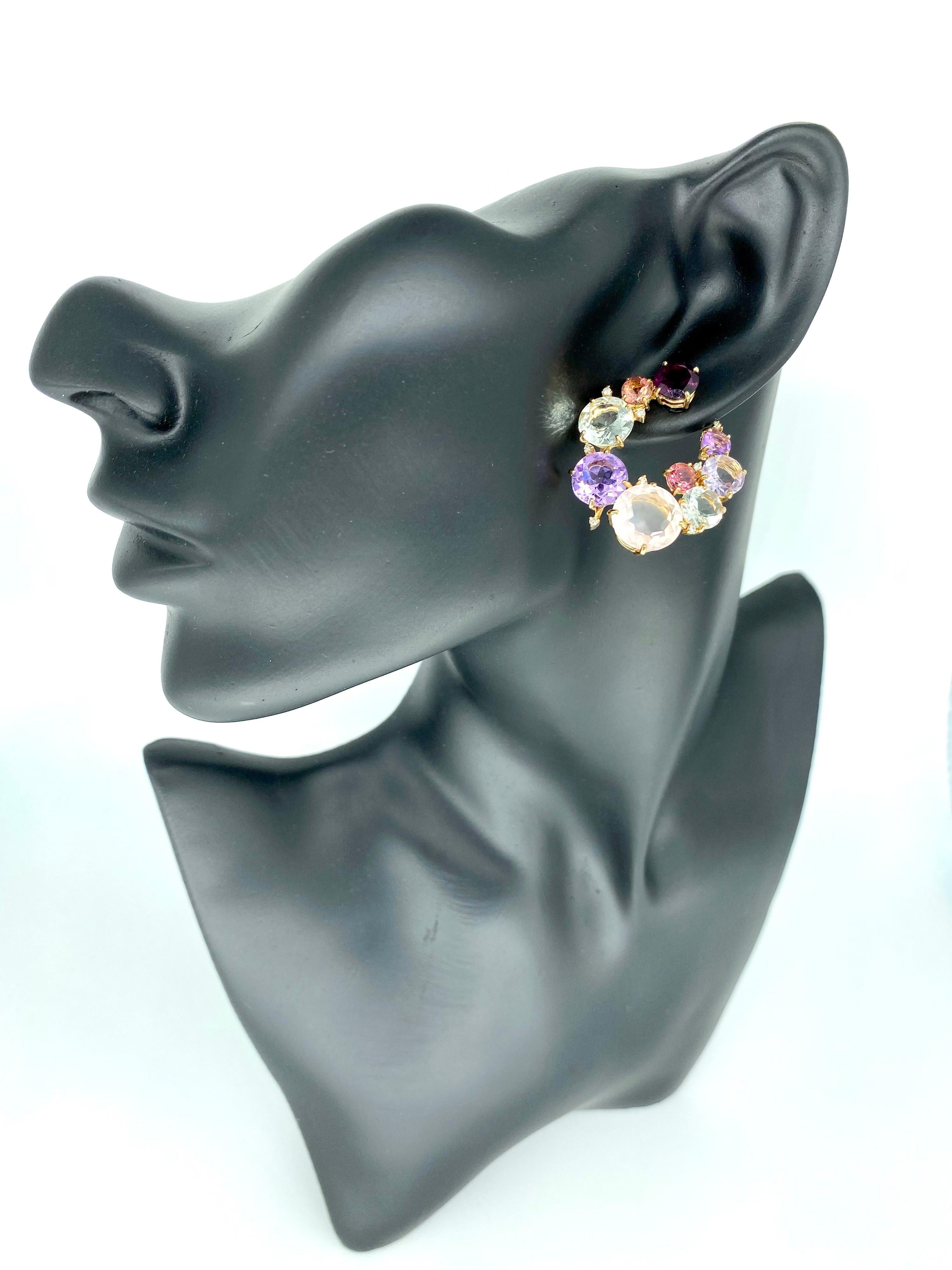 Vintage Designer stamped RV:
55 Carat Multi Gemstone & Diamonds Clip Earrings 18k Rose Gold
The earrings feature beautiful tourmalines, amethyst, Garnet & Diamonds weighting a total of approx 55 carats. Hand crafted by designer and stamped RV 750.