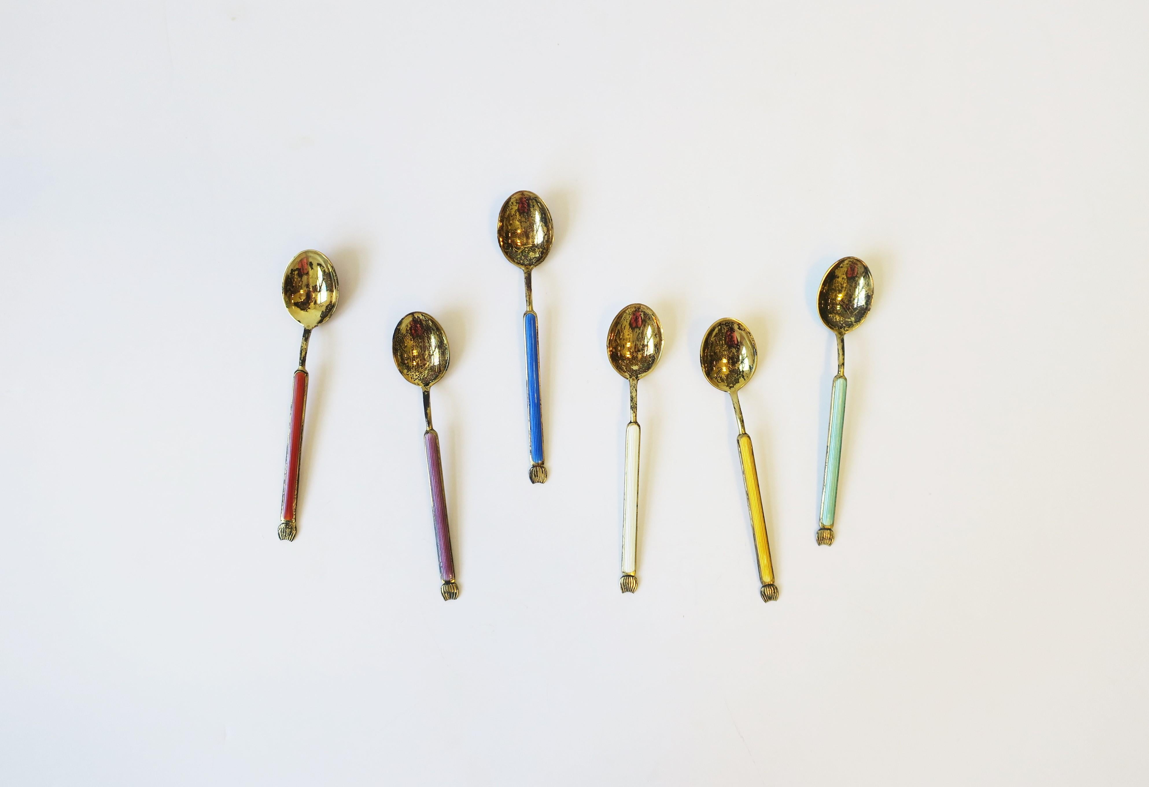 A beautiful set of six (6) Scandinavian Modern Danish Modern sterling silver, gold vermeil and enamel spoons by designer Anton Michelsen, circa early-20th century, Denmark. These beautiful spoons are espresso coffee tea demitasse size spoons. Each