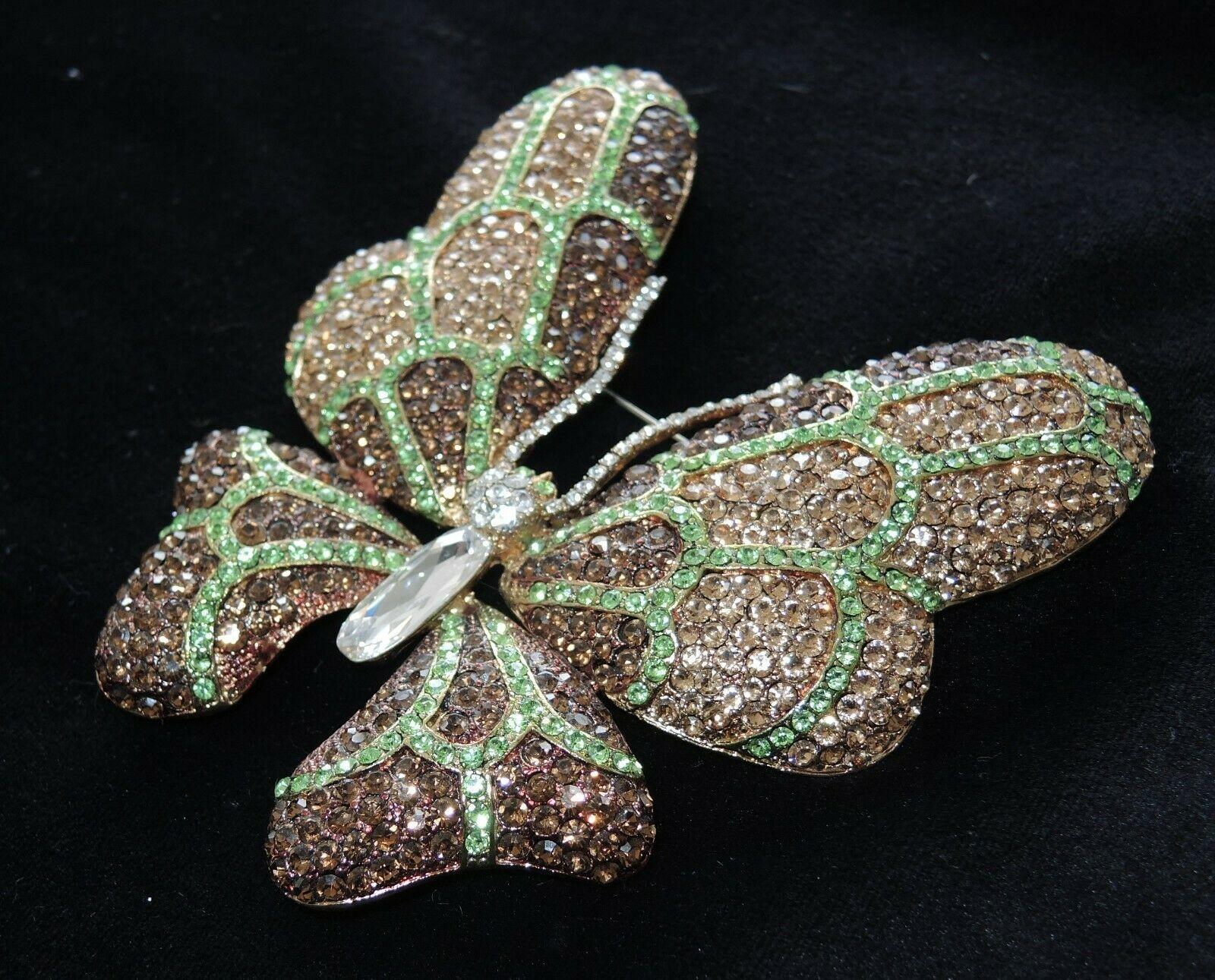 Sensational CARLO ZINI Designer Butterfly Crystal Brooch Pin. Encrusted and Hand set with Sparkling Crystals in brown, champagne, light green and clear. Measuring approx. 3.75” w x 4.50” h. Signed: ZINI. Comes with original pouch and tag. Pristine,