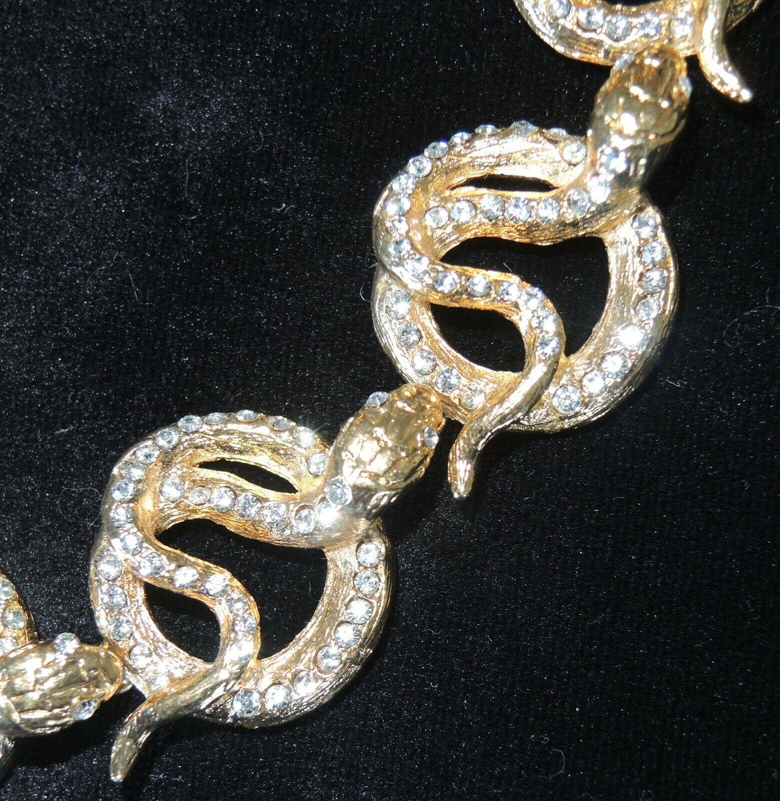 Designer Carlo Zini Sparkling Crystal Serpent Snake Choker Necklace; Gold tone mounting Hand set with Sparkling Crystals. Lobster clasp closure; approx. length is 17.5” Signed: CARLO ZINI on oval plaque. Made in Milano Italy. Never worn. Original