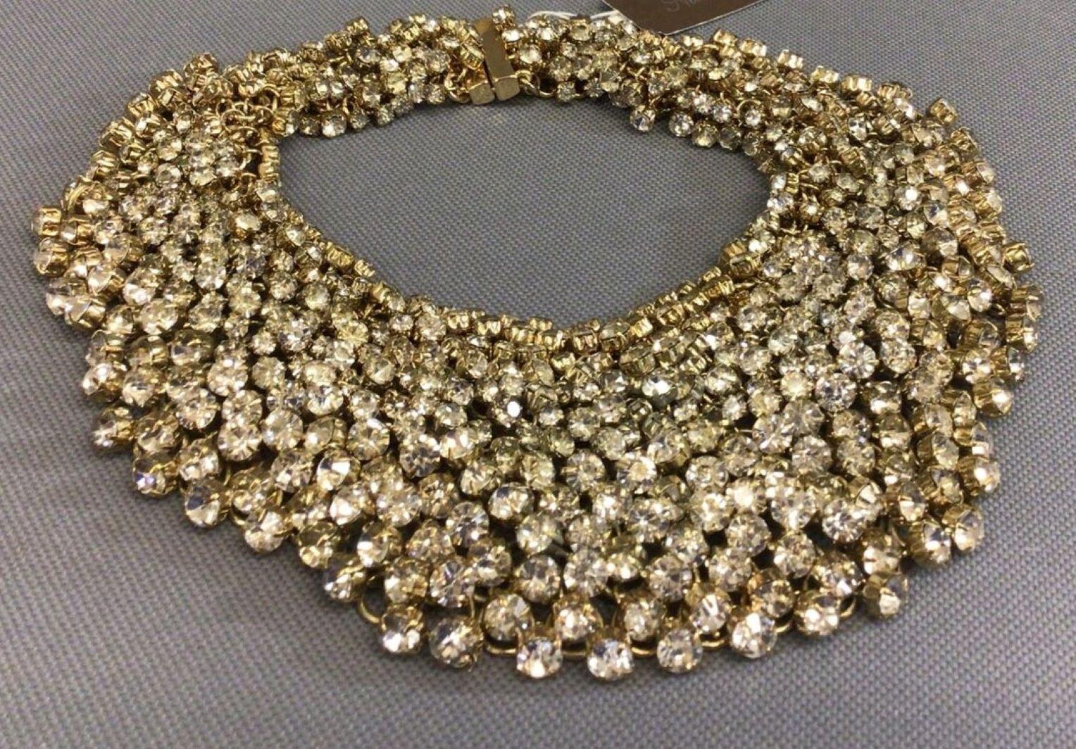 Awesome Designer Natasha Bib Collar Necklace featuring Crystals Hand set in Gold tone mountings. Necklace with magnetic closure measures approx. 15” long. NWT. Sure to be admired Perfect compliment to your wardrobe!