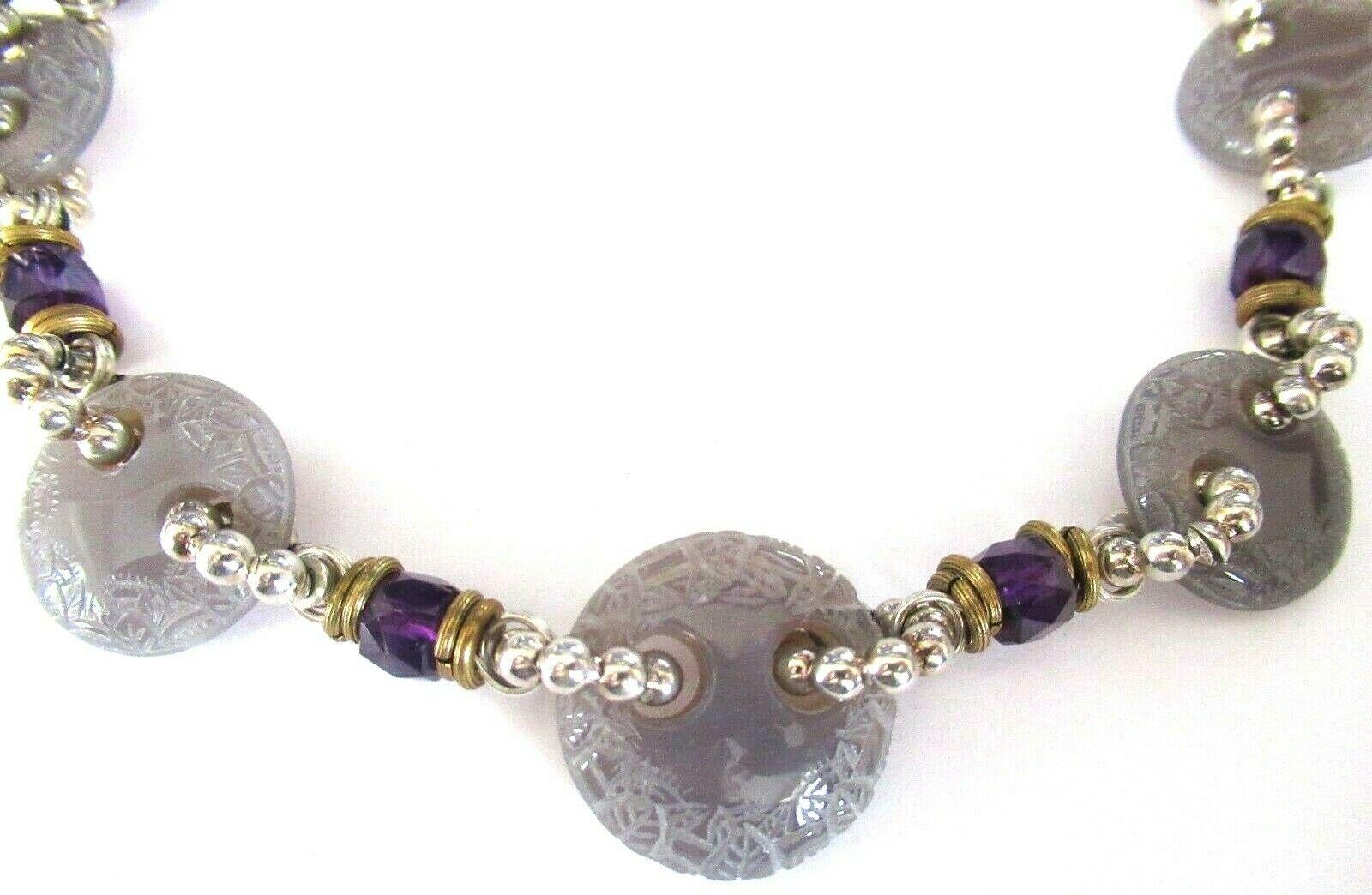Designer Signed Stephen Dweck Choker Necklace. Genuine Purple Amethyst Crystals inter-spaced with Carved Light Purple Stone Discs and Sterling Silver 925 spacers. Hand crafted Necklace measures approx. 19