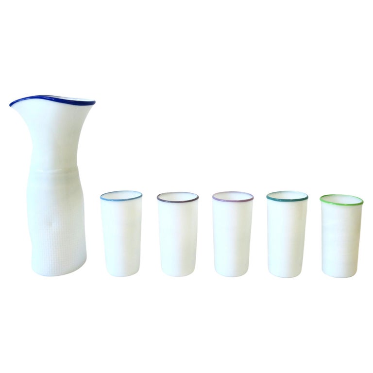 https://a.1stdibscdn.com/designer-signed-white-art-glass-pitcher-carafe-and-glass-set-circa-1980s-for-sale/f_13142/f_291760821655660408492/f_29176082_1655660409140_bg_processed.jpg?width=768