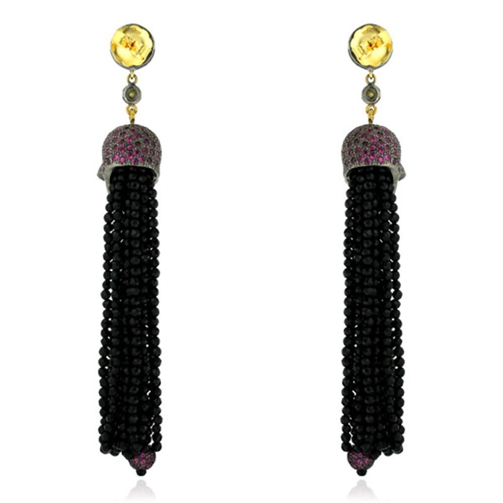 Designer Skull Tassel Earring with Ruby, Diamond and Onyx in silver and onyx is fun and very dramatic.

18kt gold:2.3gms
Diamond:1.31cts
Ruby:4.95Cts,
Onyx Black:74.95cts