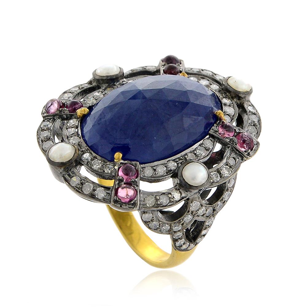 Designer Slice Blue Sapphire Ring with Diamond and Pearls set in Gold and silver is stunning and can be worn for any ocassion.

18kt gold:1.44gms
Diamond:0.86cts
Silver:4.38gms
Sapphire:10.15cts
Mix:1.03cts
