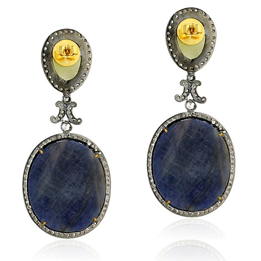 Designer 2 tier blue and pale yellow slice sapphire earring with diamonds is hand-crafted with gold push and post.

18k: 2.42g
Diamond: 3.74ct
SAPPHIRE: 80.2Cts