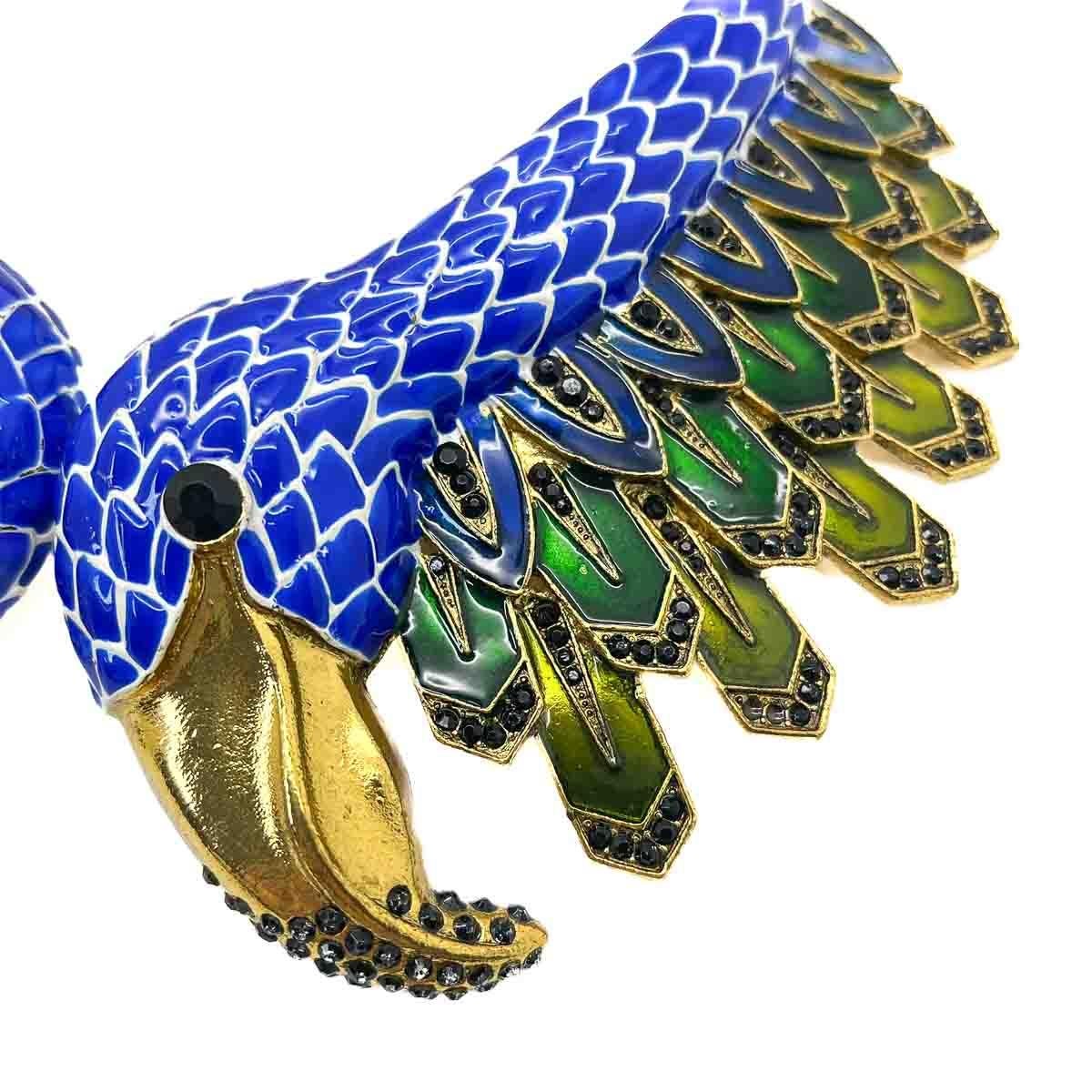 enamelling in deep Mediterranean blue, emerald and lime greens is off set with lavish high carat gold beaks and edging - the black glass chatons adding the final detail to this extraordinary design.

Vintage Condition: Very good without damage or