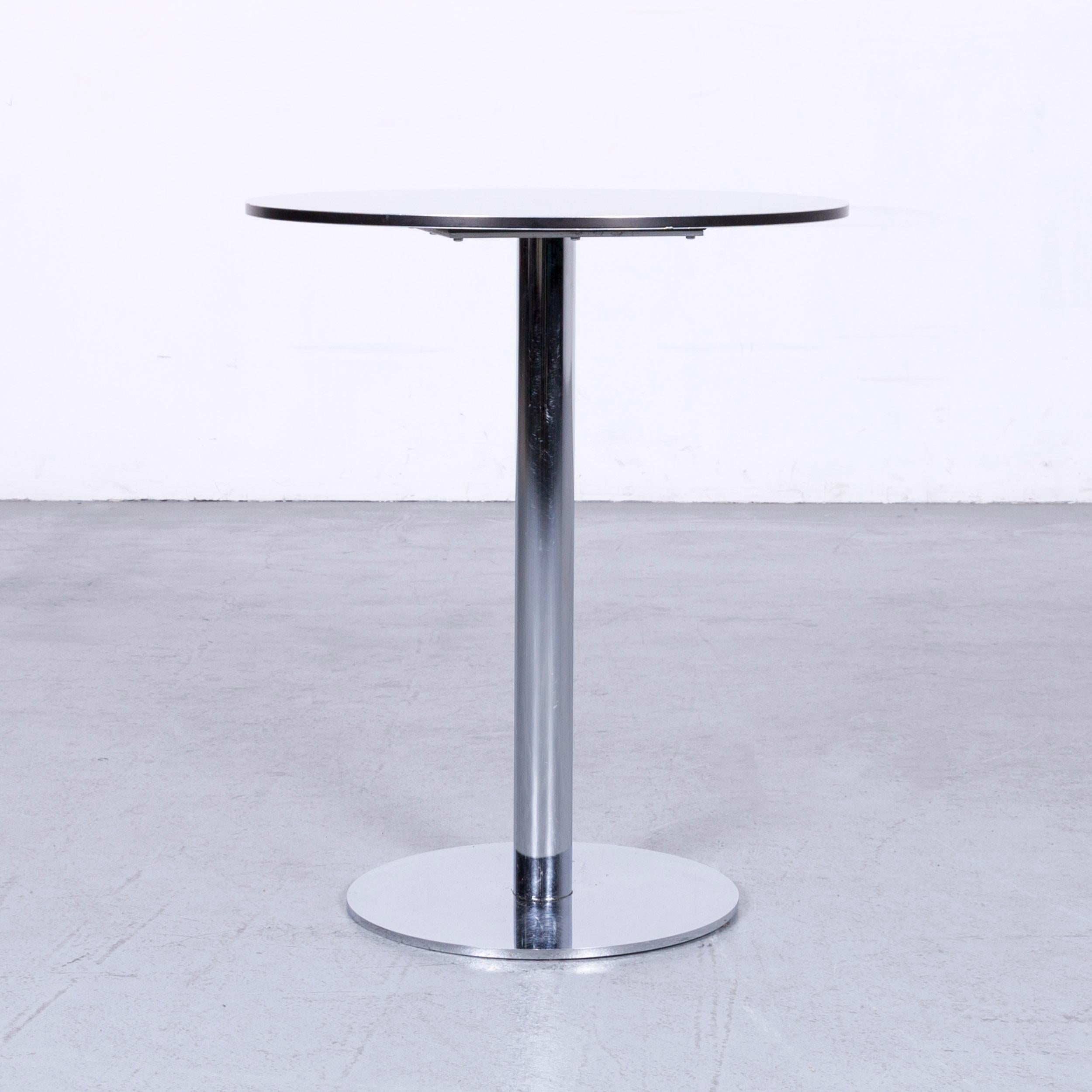 White colored designer bistro table in a minimalistic and modern design, made for pure style and functionality.