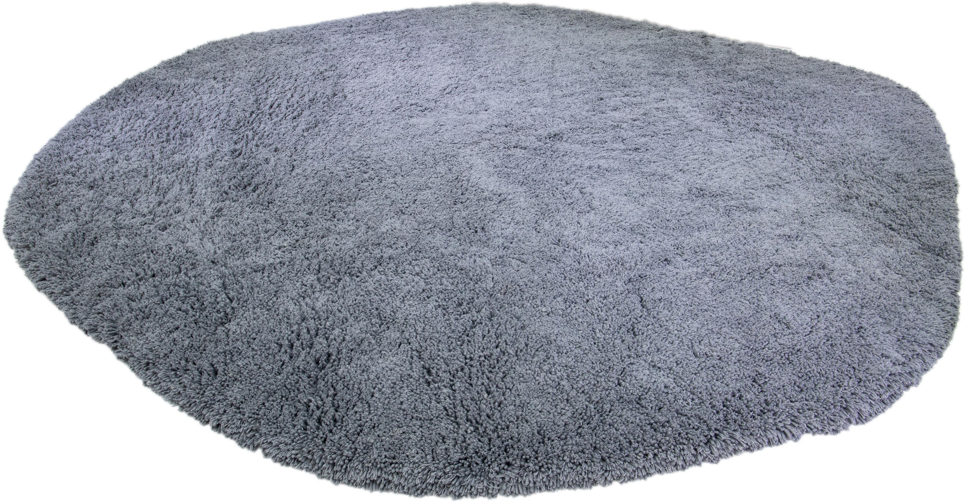 Soft and luxurious, this modern wool oval area rug is sure to transform your space! It boasts a solid grey field and textured pattern, creating a contemporary feel.

This rug measures: 19' x 19'.

