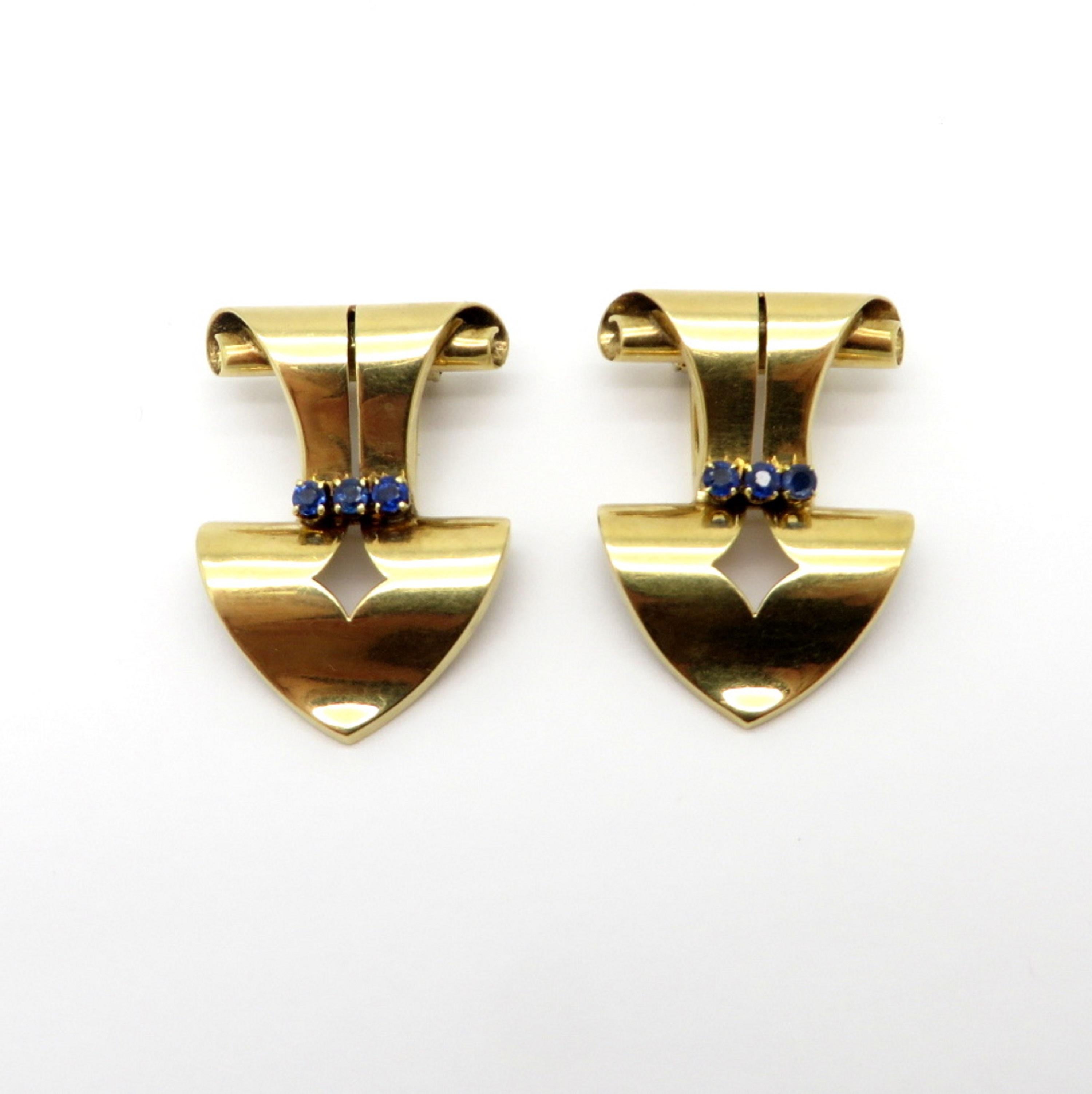 Designer Tiffany & Co. 14K yellow gold sapphire cufflink clips. Showcasing six round brilliant cut sapphires, four prong crown set, measuring 2.8 mm each. Includes a Tiffany & Co. box. Each clip measures 1.5” inches x 1” inch. The total net weight