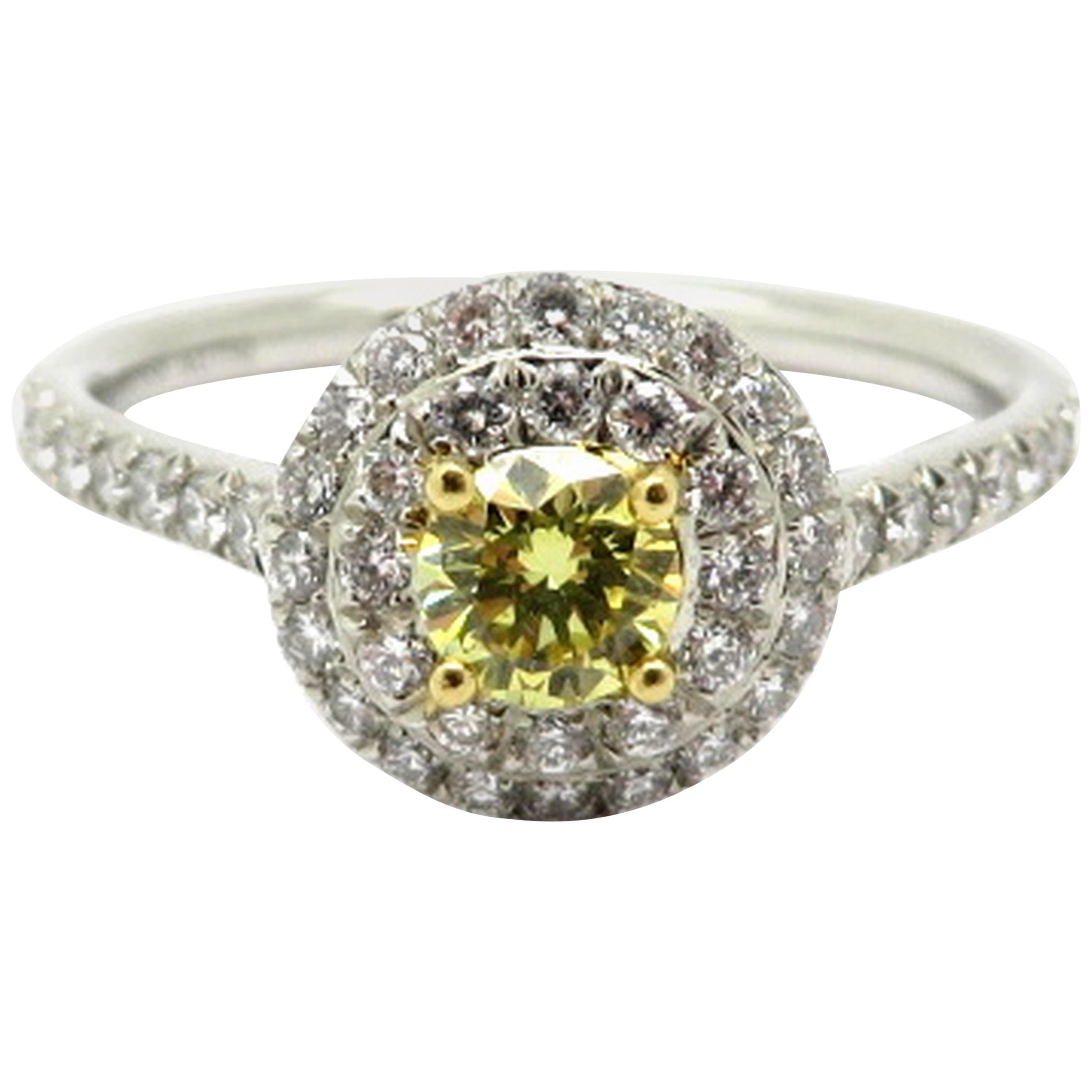 Designer Tiffany & Co. Platinum and 18 Karat Fancy Yellow Diamond Halo Ring For Sale