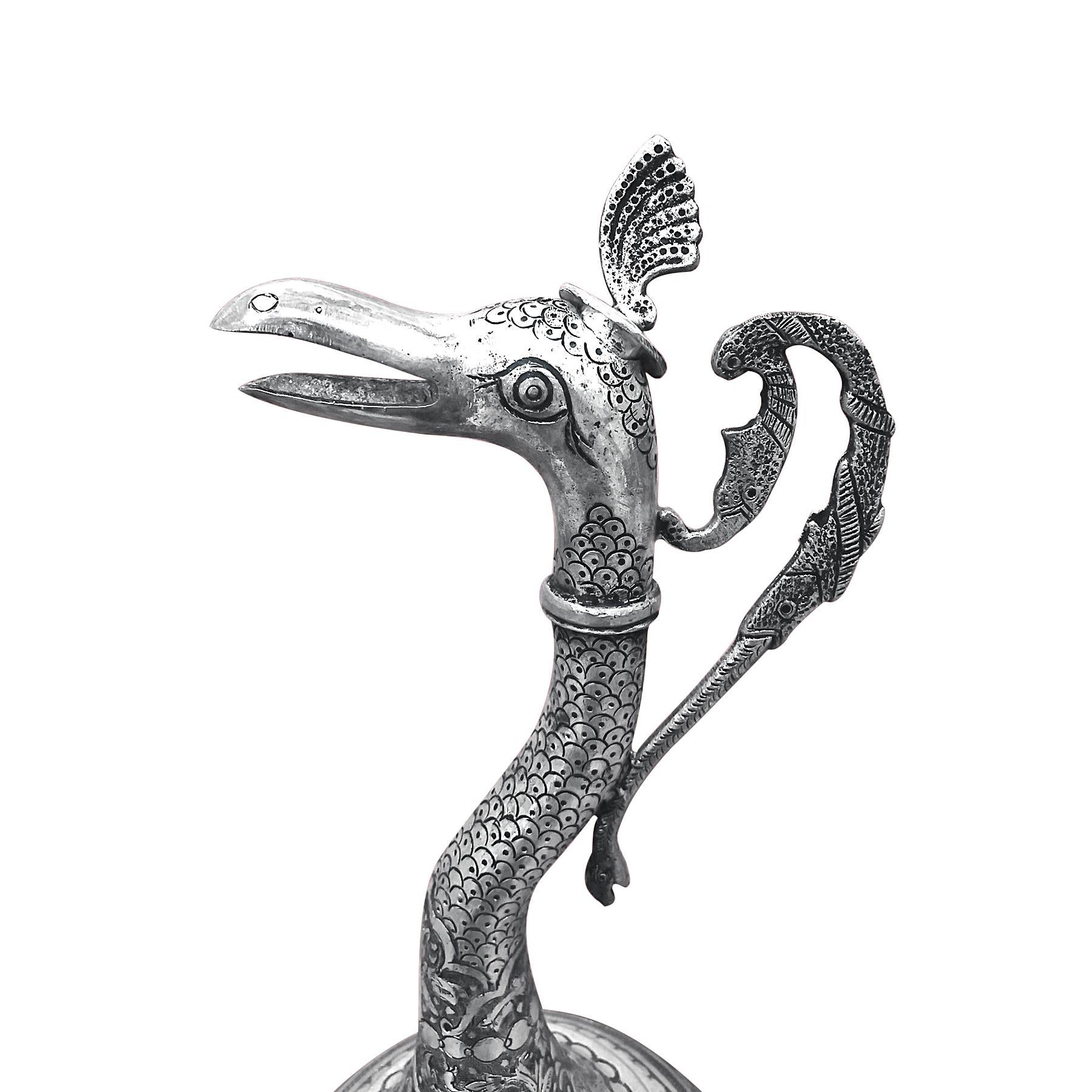 Vintage, dandy and well detailed, this Vertan swan-shaped wine jar was hand carved in Persia using Persian silver about 0.84 proof. With round bottom and tall neck, this old piece has a height of 14 inches, a width of 6 inches and weighs 1097 grams.