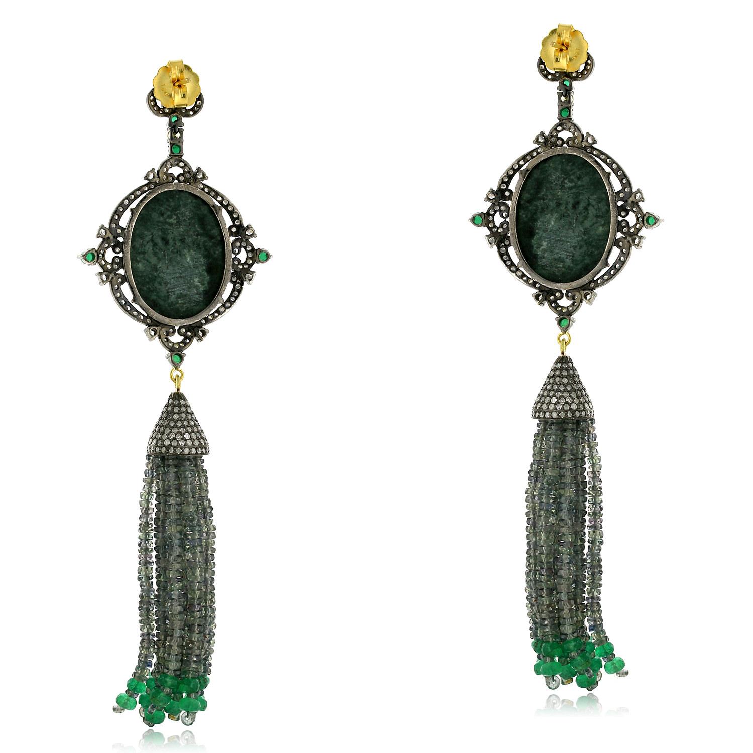 Designer Vintage looking Cameo Tassel Earring with Diamond and Sapphires in Gold and silver. The cameo is hand carved out of lava stone which makes this earring one of a kind.

18kt gold:1.88gms
Diamond:4.34cts
Cameo:35.15cts
