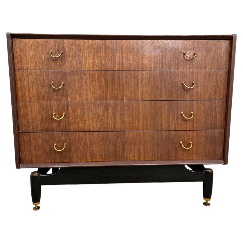 Cassettiera in teak vintage retrò degli anni '50 di design su gambe ebanizzate