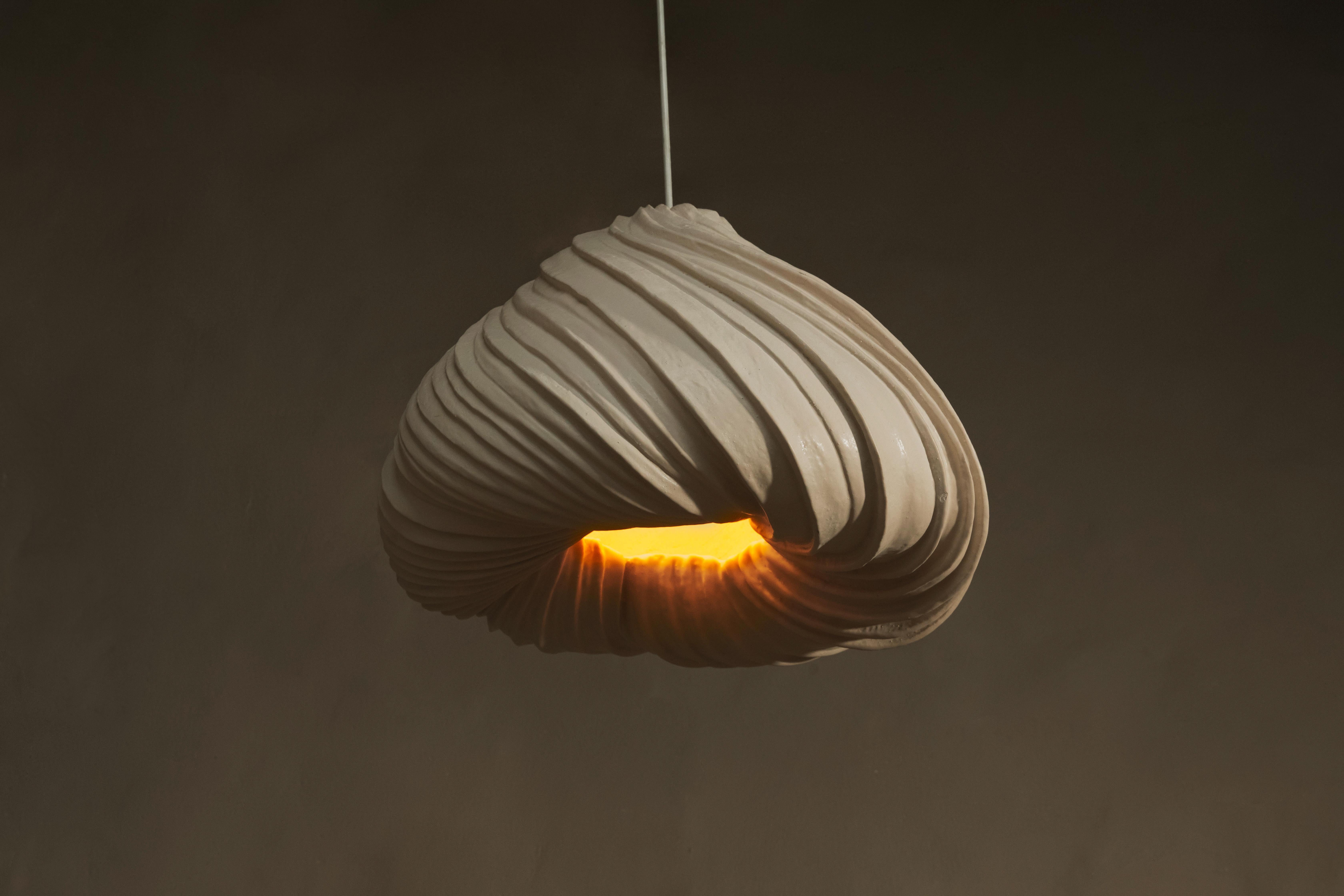 MUSHLYA is an incredible designer lamp made using a unique
technique of thin layering. It means 