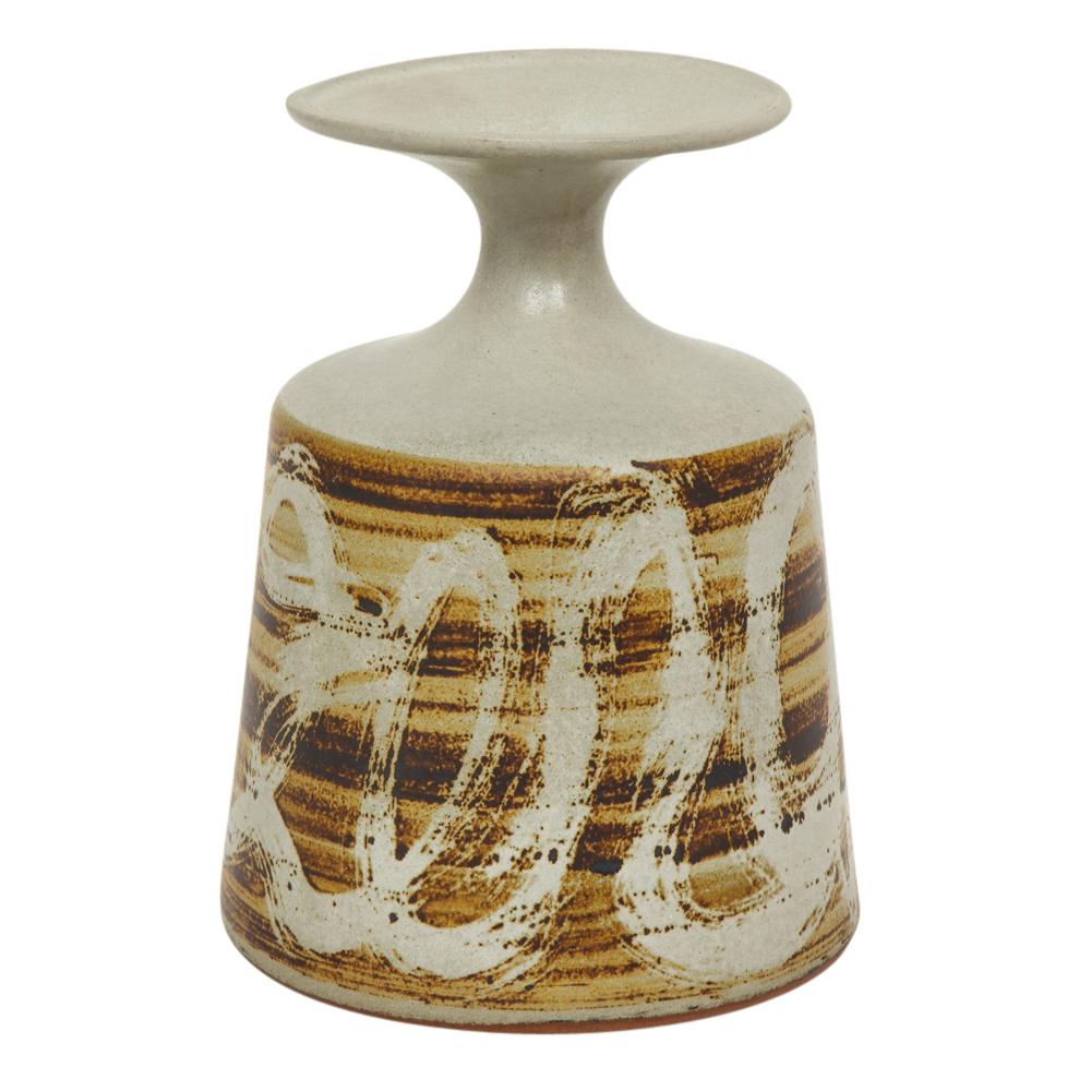 Designs west vase, ceramic stoneware Earth tones, signed. Medium size vase with flared lip, tapered neck and chunky body with brown or beige abstract pattern over a gray glaze. Retains maker's label on the underside: Handcrafted stoneware by Designs