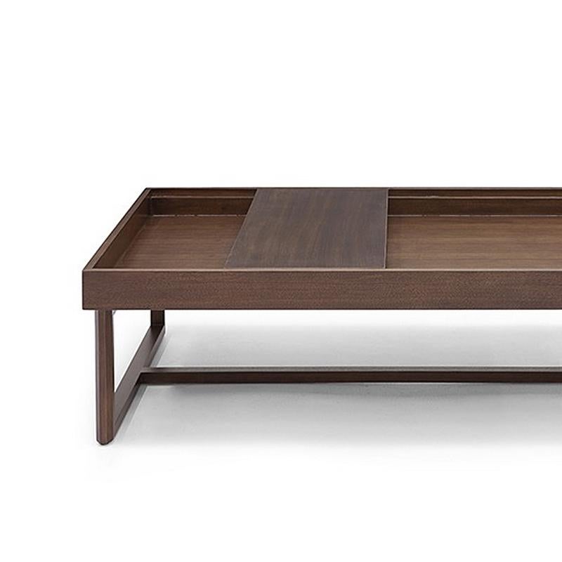 Wooden coffee table with sliding tray.