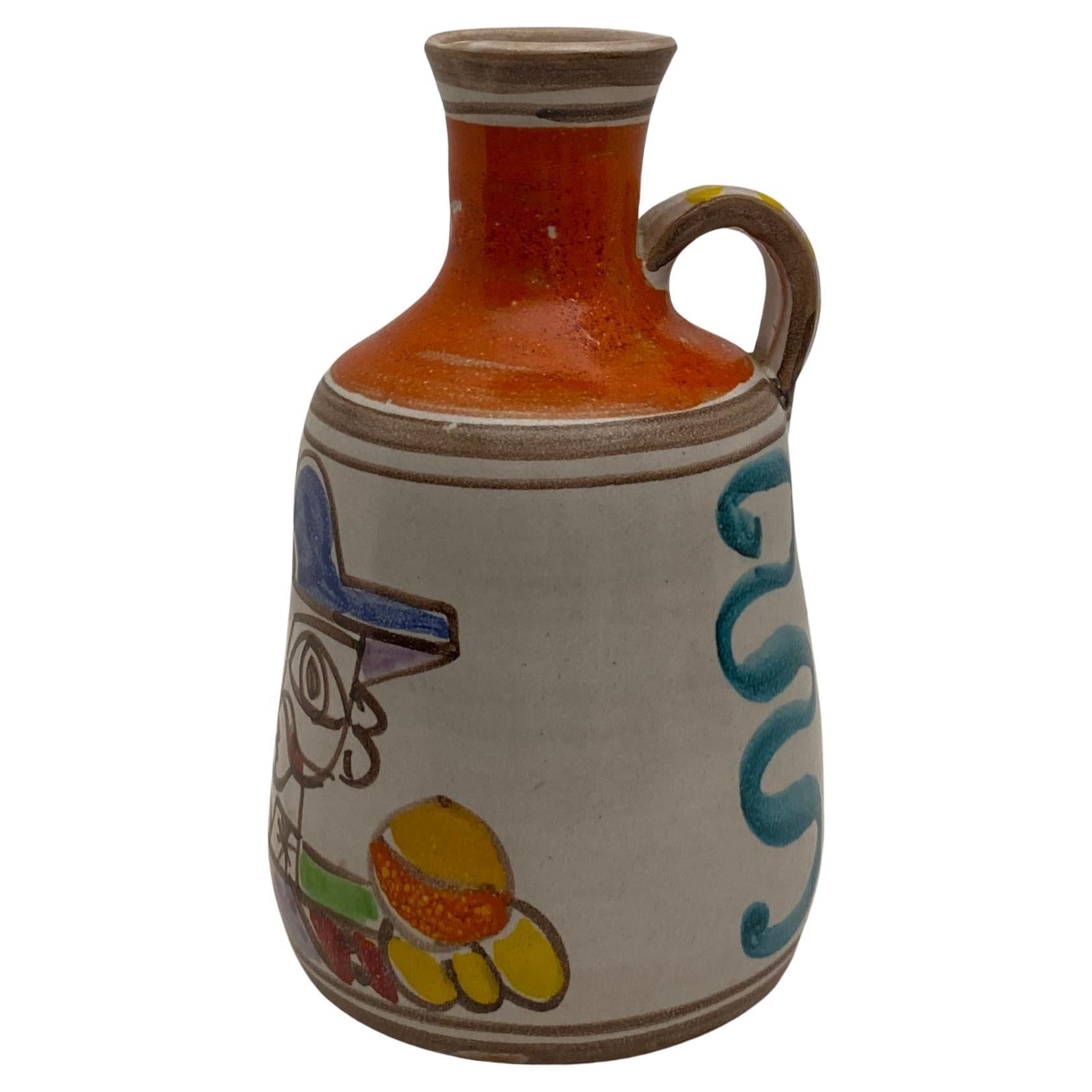 One-of-kind handled vase, hand-crafted and hand-painted by Giovanni Desimone. Great design with a whimsical figurative image on the front and other accentuating decor on the sides.

Signed and numbered, this rare piece is colorful as are all