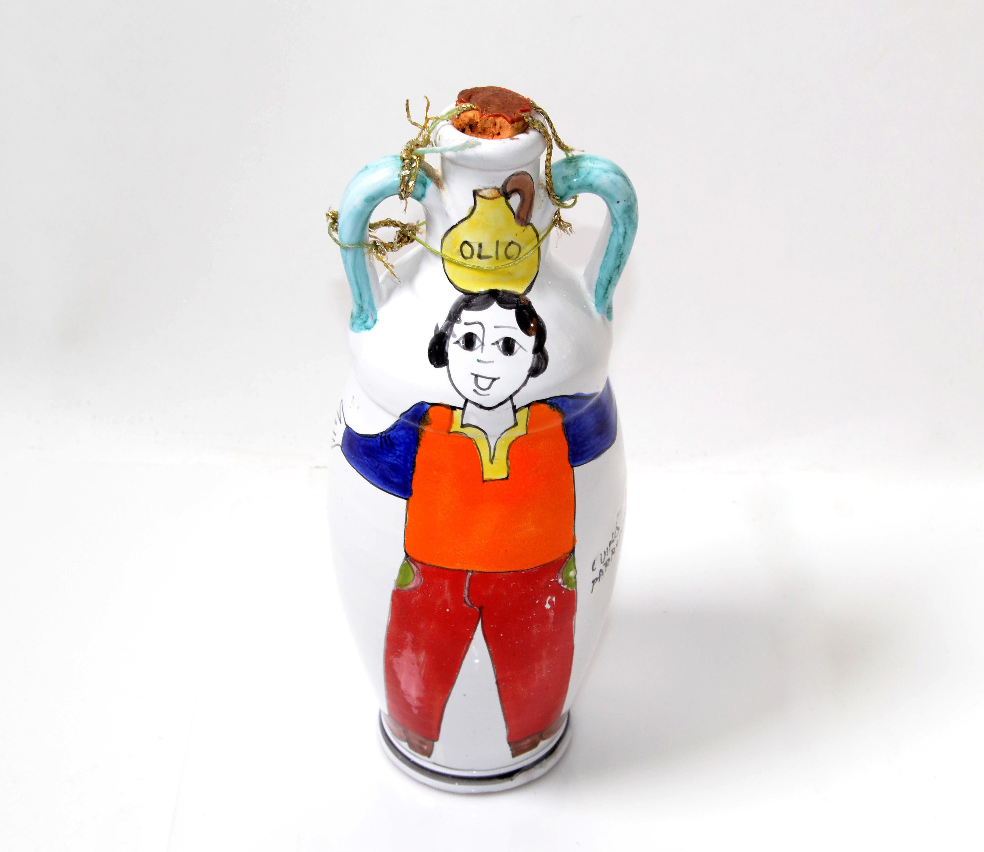 A glazed and colorful Giovanni Desimone hand painted pottery oil decanter, bottle, jar or vessel, circa 1969 from Italy.
The vessel is 10.75 inches high and 4 inches in diameter and is in very good condition with no chips or cracks. The Oil is